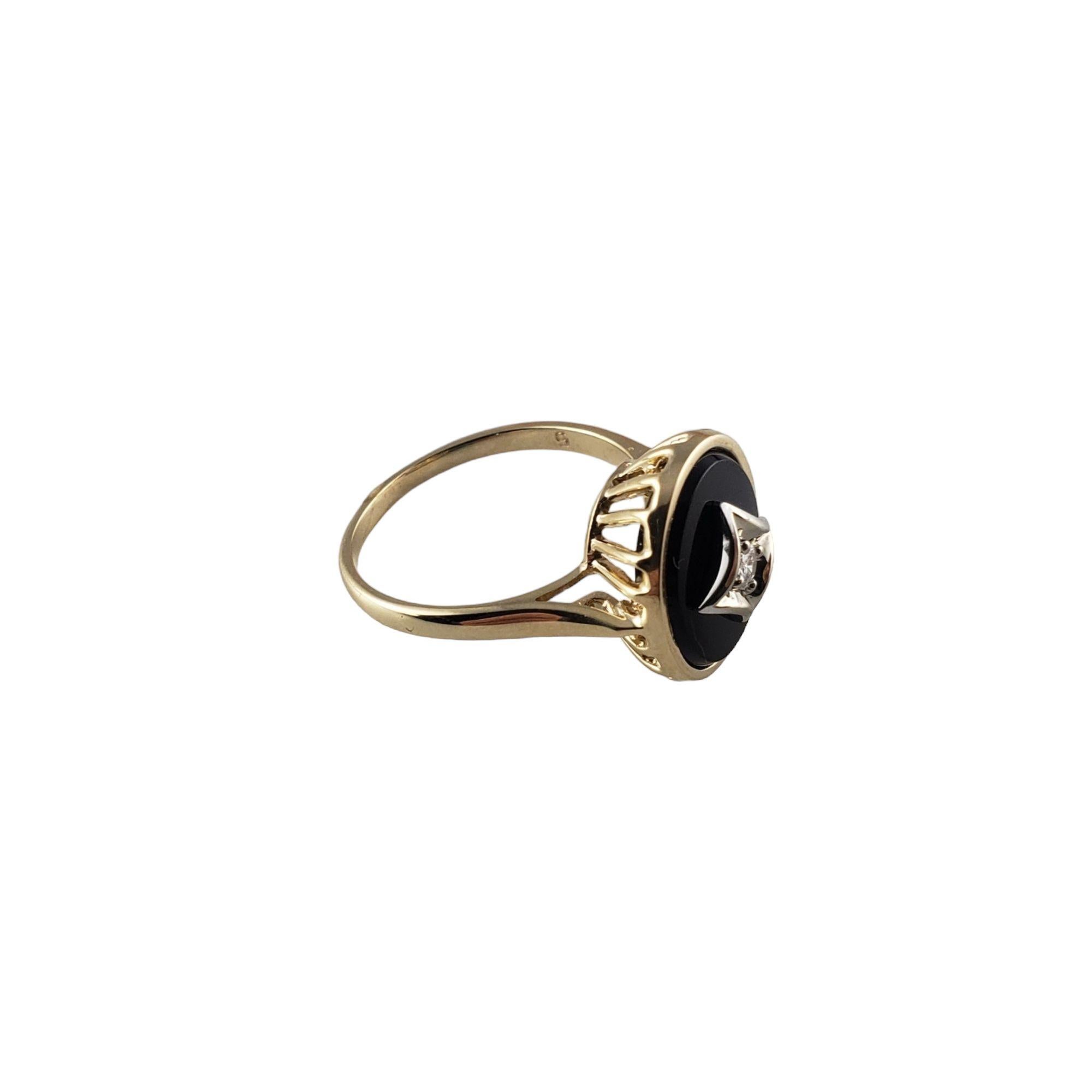 Vintage 14 Karat Yellow Gold Onyx and Diamond Ring Size 6.25-

This lovely black onyx ring features one round brilliant cut diamond set in beautifully detailed 14K yellow gold.
Top of ring measures 14 mm x 12 mm. Shank: 1 mm.

Approximate total