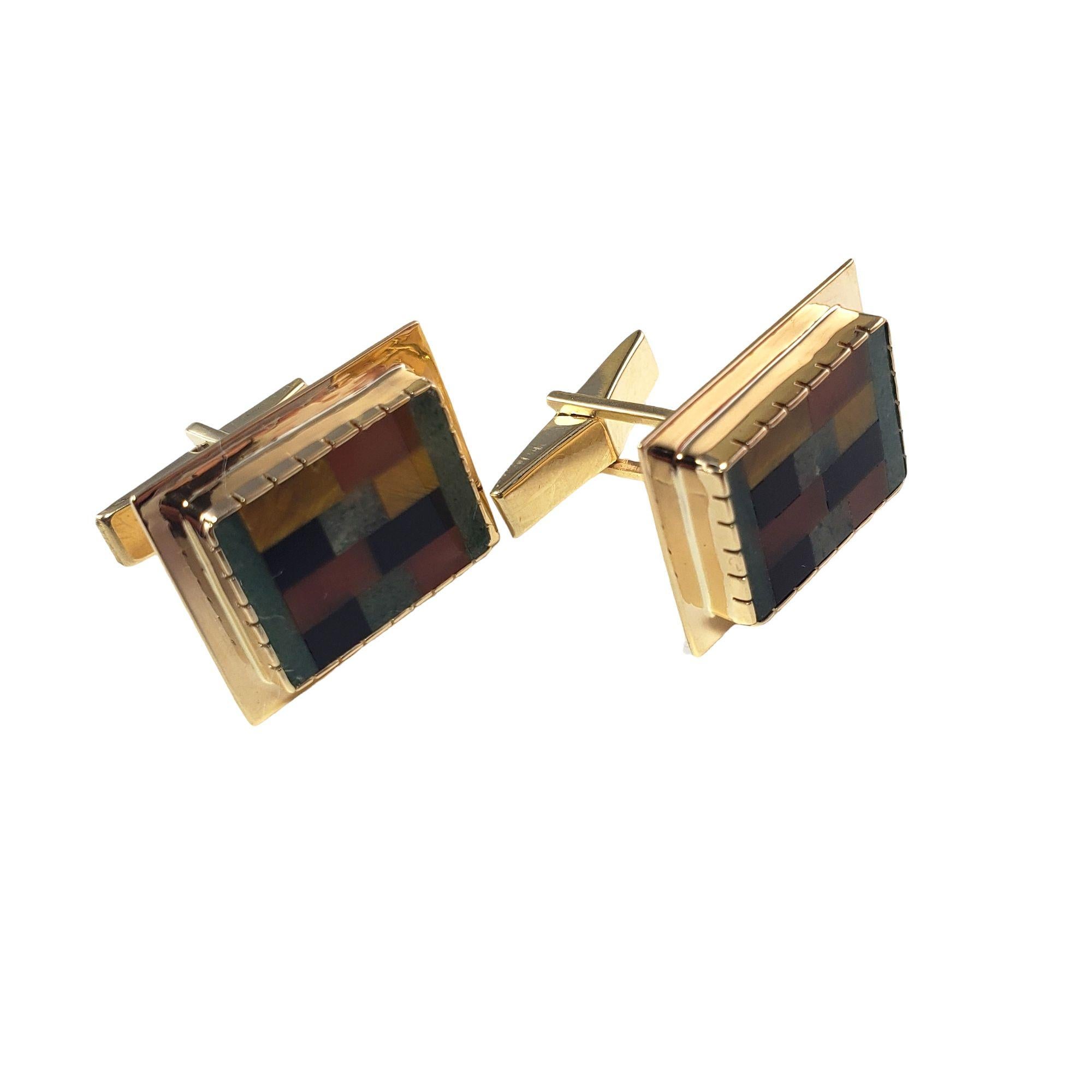 Vintage 14 Karat Yellow Gold Onyx, Carnelian and Tiger's Eye Cufflinks-

These stunning cufflinks feature onyx, carnelian and tiger's eye inlay set in beautifully detailed 14K yellow gold.

Size: 21 mm x 17 mm

Weight: 11.3 gr./ 7.3 dwt.

Stamped: