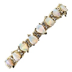 14 Karat Yellow Gold Opal and Diamond Bangle Bracelet