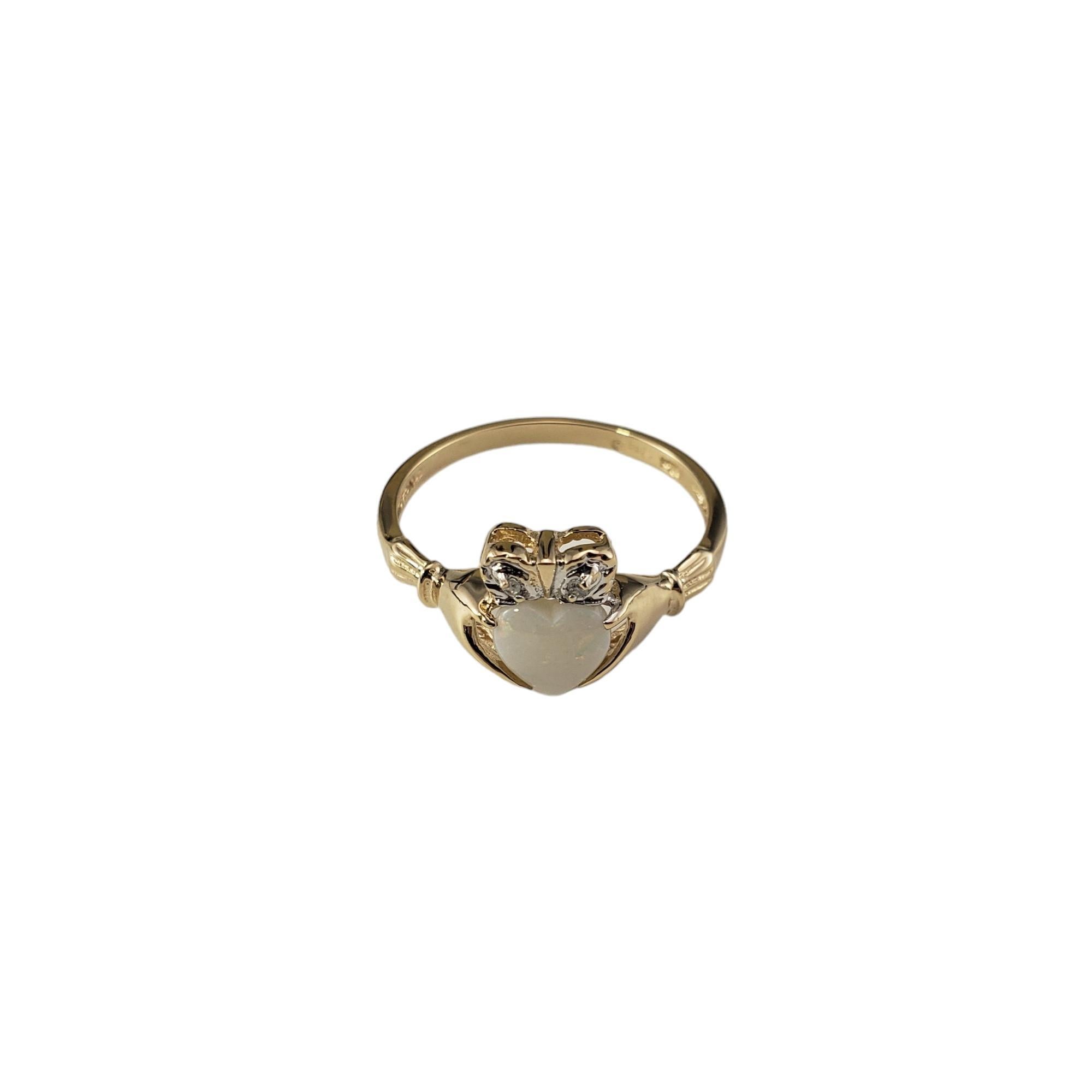 14 Karat Yellow Gold Opal and Diamond Claddagh Ring Size 7.25-

This lovely Claddagh ring features one heart shaped opal and two round single cut diamonds set in beautifully detailed 14K yellow gold.  

Width: 9 mm.  Shank: 1.5 mm.

Approximate