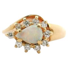 14 Karat Yellow Gold Opal and Diamond Halo Ring