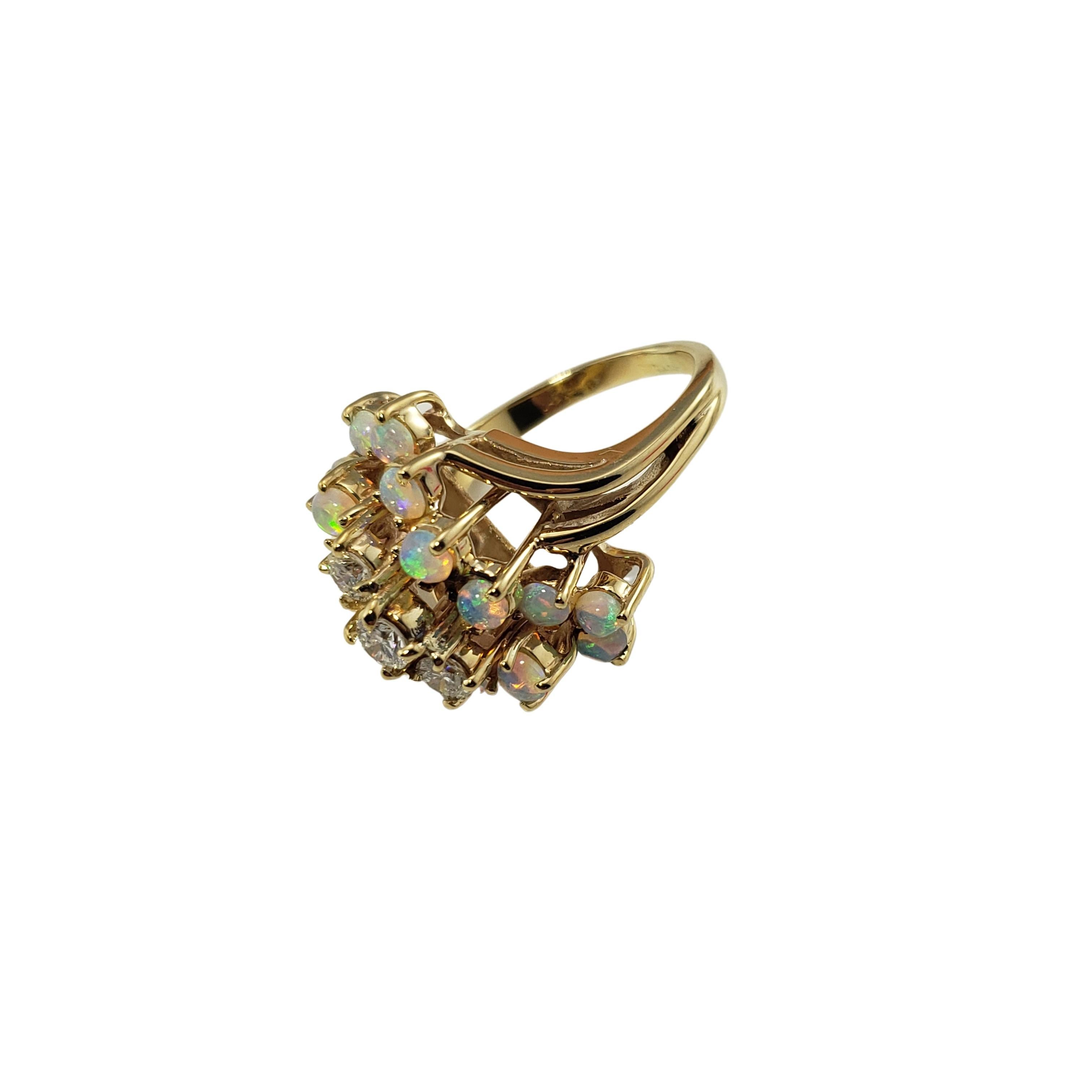 14 Karat Gold Opal and Diamond Ring Size 6.5-

This stunning ring features 16 round opals and three round brilliant cut diamonds set in classic 14K yellow gold.  Width:  19 mm.
Shank:  2 mm.  Height:  14 mm.

Approximate total diamond weight:  .35