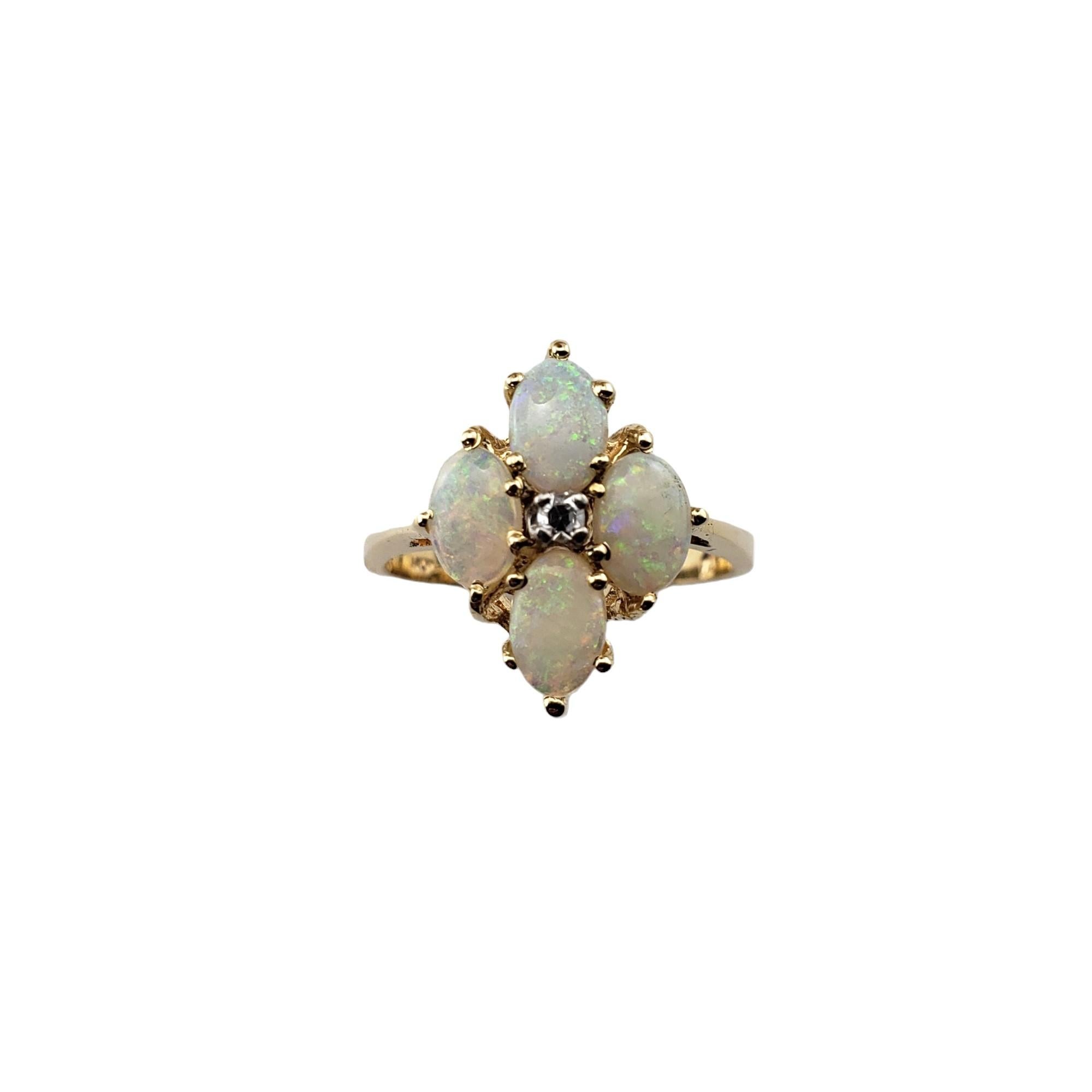 Vintage 14 Karat Yellow Gold Opal and Diamond Ring Size 6.75-

This elegant ring features four oval opals (7 mm x 5 mm) and one round single cut diamond set in classic 14K yellow gold.  
Width: 15.8 mm.  Shank: 2 mm.

Approximate total diamond