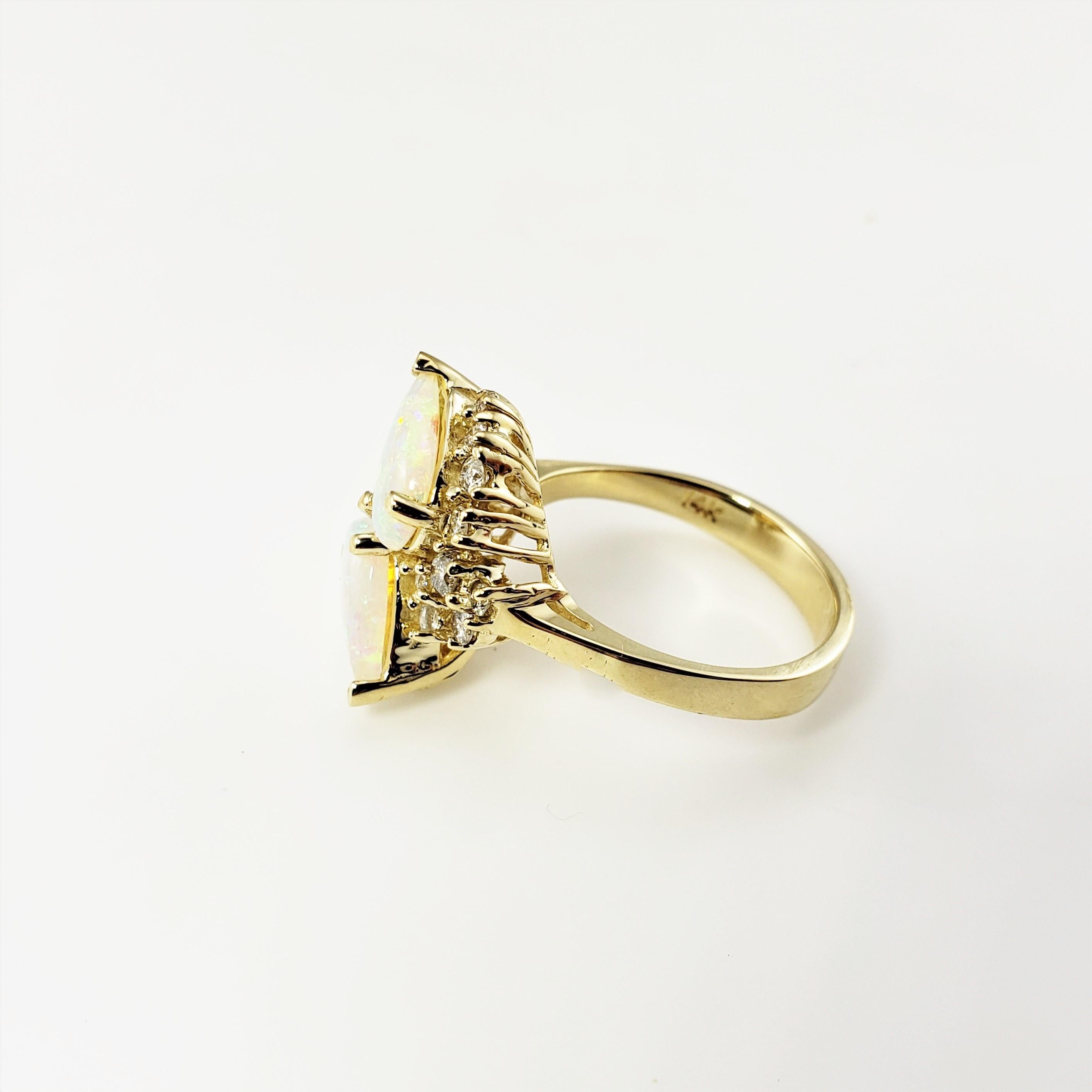Anillo de oro amarillo de 14 quilates con ópalo y diamantes talla 6.75-

Este precioso anillo tiene dos ópalos en forma de pera (10 mm x 6 mm) y 18 diamantes redondos de talla brillante engastados en oro amarillo clásico de 14 quilates.
La parte