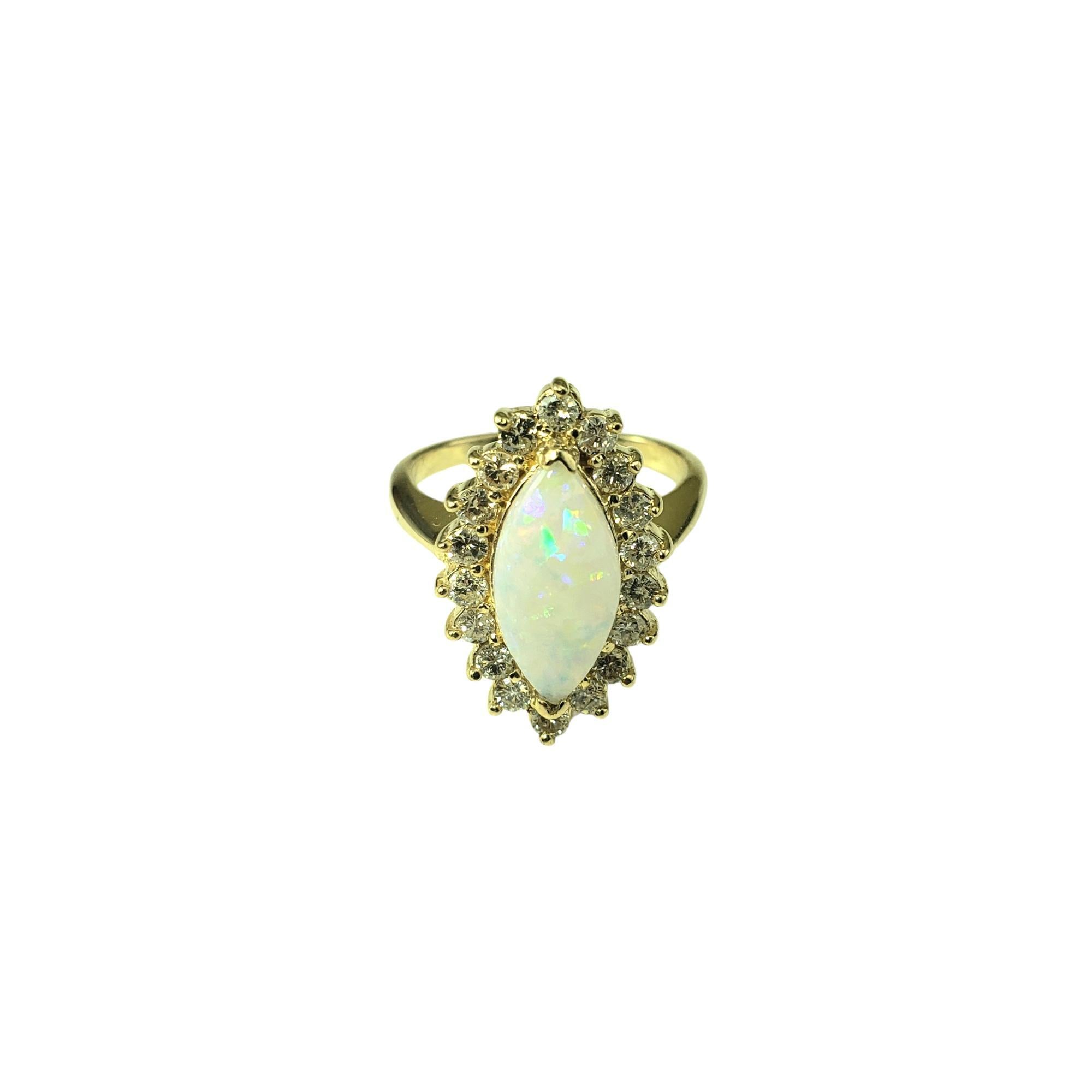 14 Karat Yellow Gold Opal and Diamond Ring Size 7.75 JAGi Certified-

This stunning 14K yellow gold ring features one marquise shaped white cabochon opal (15.1 mm x 7.1 mm) surrounded by 18 round brilliant cut diamonds.

 Top of ring measures 22 mm