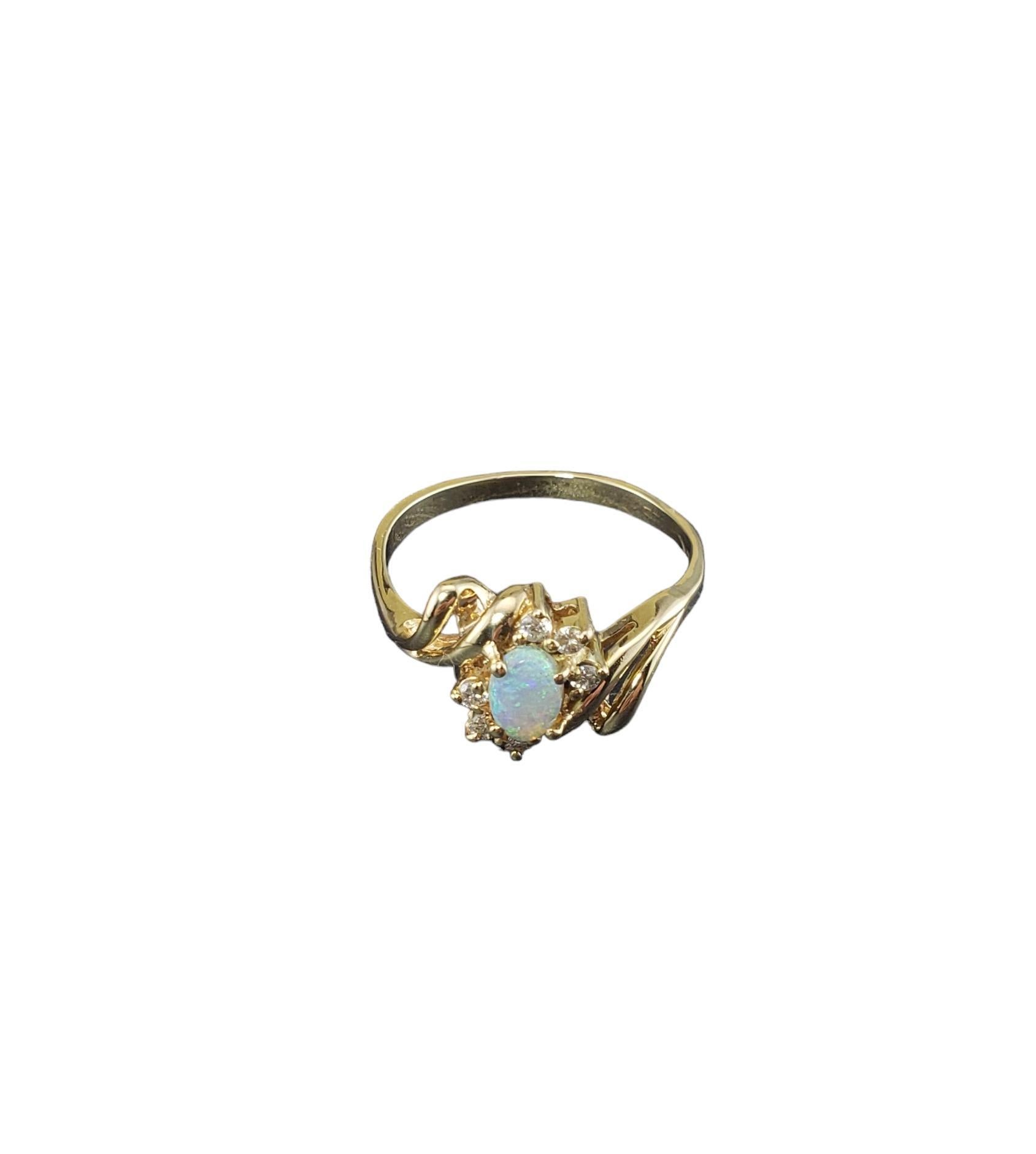 Vintage 14K Yellow Gold Opal and Diamond Ring Size 8.25-

This elegant ring features one oval opal stone (7 mm x 4 mm) and six round brilliant cut diamonds set in classic 14K yellow gold.  Width: 10 mm.  Shank: 2 mm.

Approximate total diamond