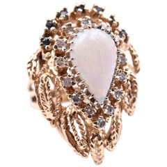 14 Karat Yellow Gold Opal, Diamond and Sapphire Vintage Ring, Era. 1950-1960