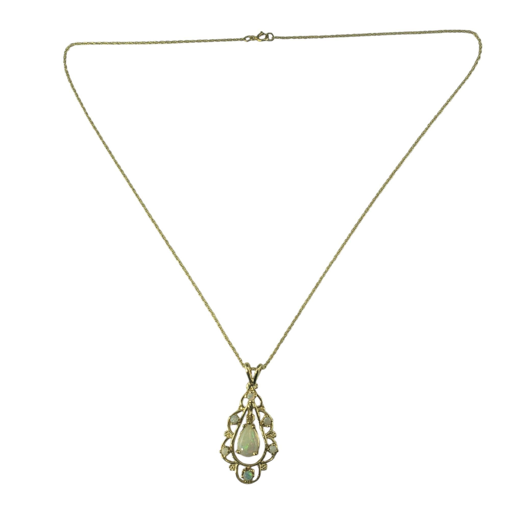 14 Karat Yellow Gold Opal Pendant Necklace-

This lovely pendant necklace features one pear shaped opal and six round opal stones set in beautifully detailed 14K yellow gold.

Size: 31.5 mm x 15 mm (pendant)
16 inches (necklace)

Weight: 2.5 dwt/