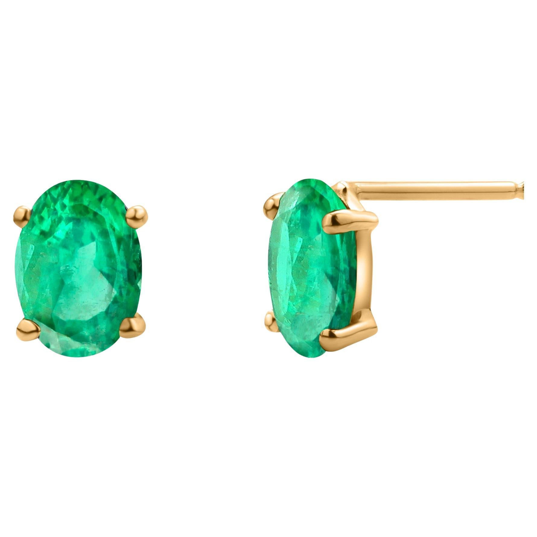 Pendientes de oro amarillo de 14 quilates con esmeralda ovalada facetada de 1,30 quilates