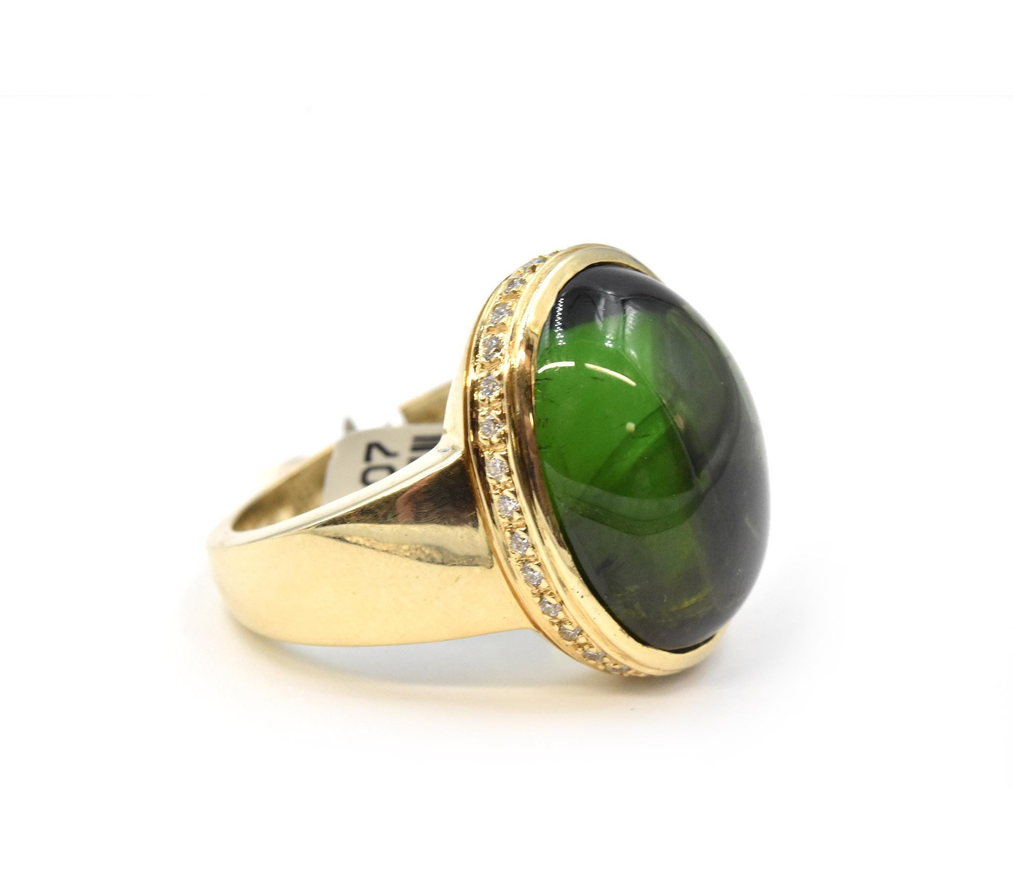 Designer: custom design
Material: 14 Yellow Gold
Green Tourmaline: 18.31ct
Diamonds: 31 Round Diamonds = .36cttw
Color: I
Clarity: SI1
Weight: 14.4g
Ring Size: 8
Dimensions: 16.84mm X 20.9mm 
