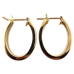 Pendientes de aro ovalados de oro amarillo de 14 quilates #18502