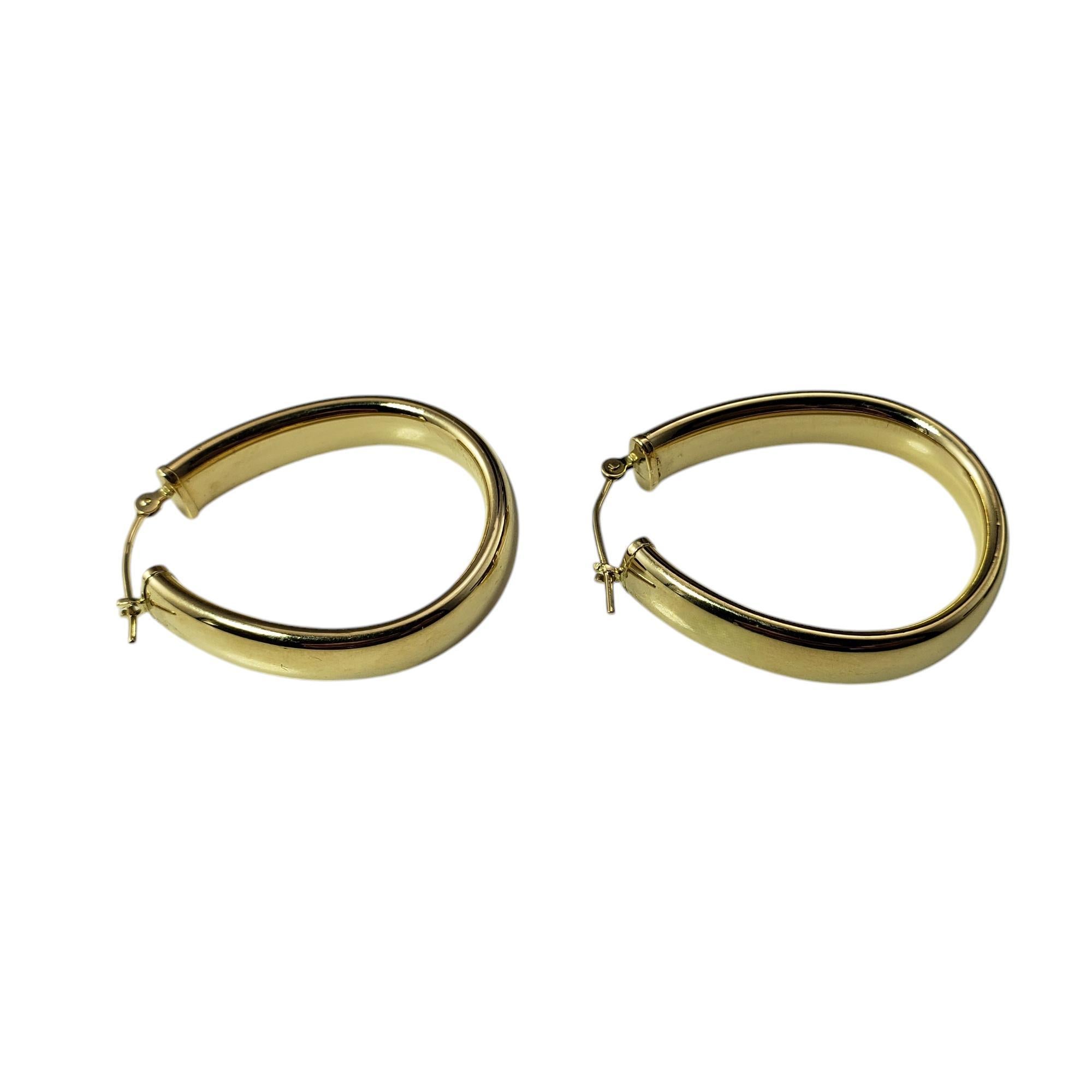 14 Karat Yellow Gold Oval Hoop Earrings

Bold yet timeless, these oval hope earrings are a sophisticated statement piece, crafted in polished 14K yellow gold.

Size: 31 mm x 6 mm

Weight: 2.1 dwt./ 3.3 gr.

Stamped: 14K

Very good condition,