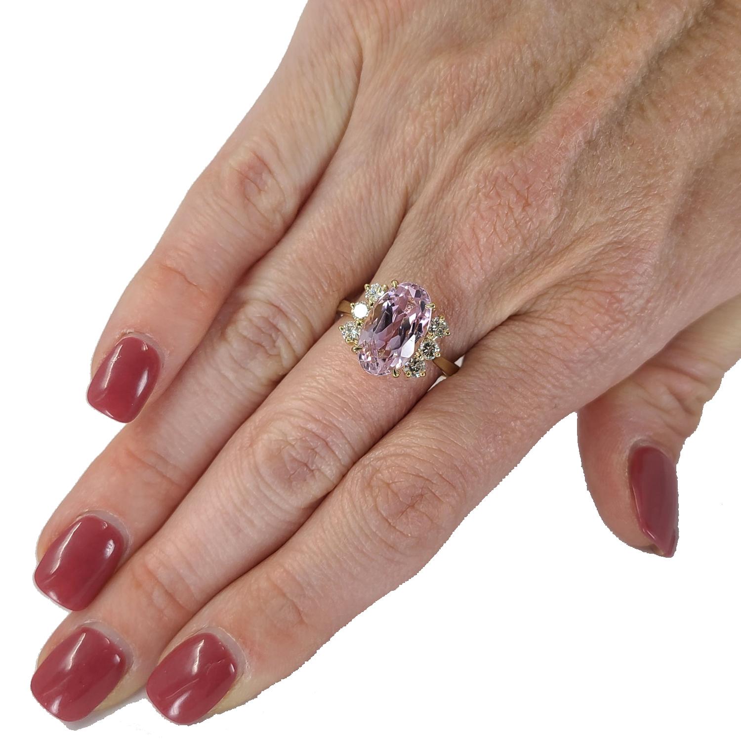 14 Karat Yellow Gold Cocktail Ring Featuring A 5.66 Carat Elongated Oval Kunzite Accented By 6 Round Brilliant Cut Diamonds Of G Color & VS Clarity Totaling 0.45 Carats. Current Finger Size Is 7.25; Purchase Includes One Sizing Upon Request.