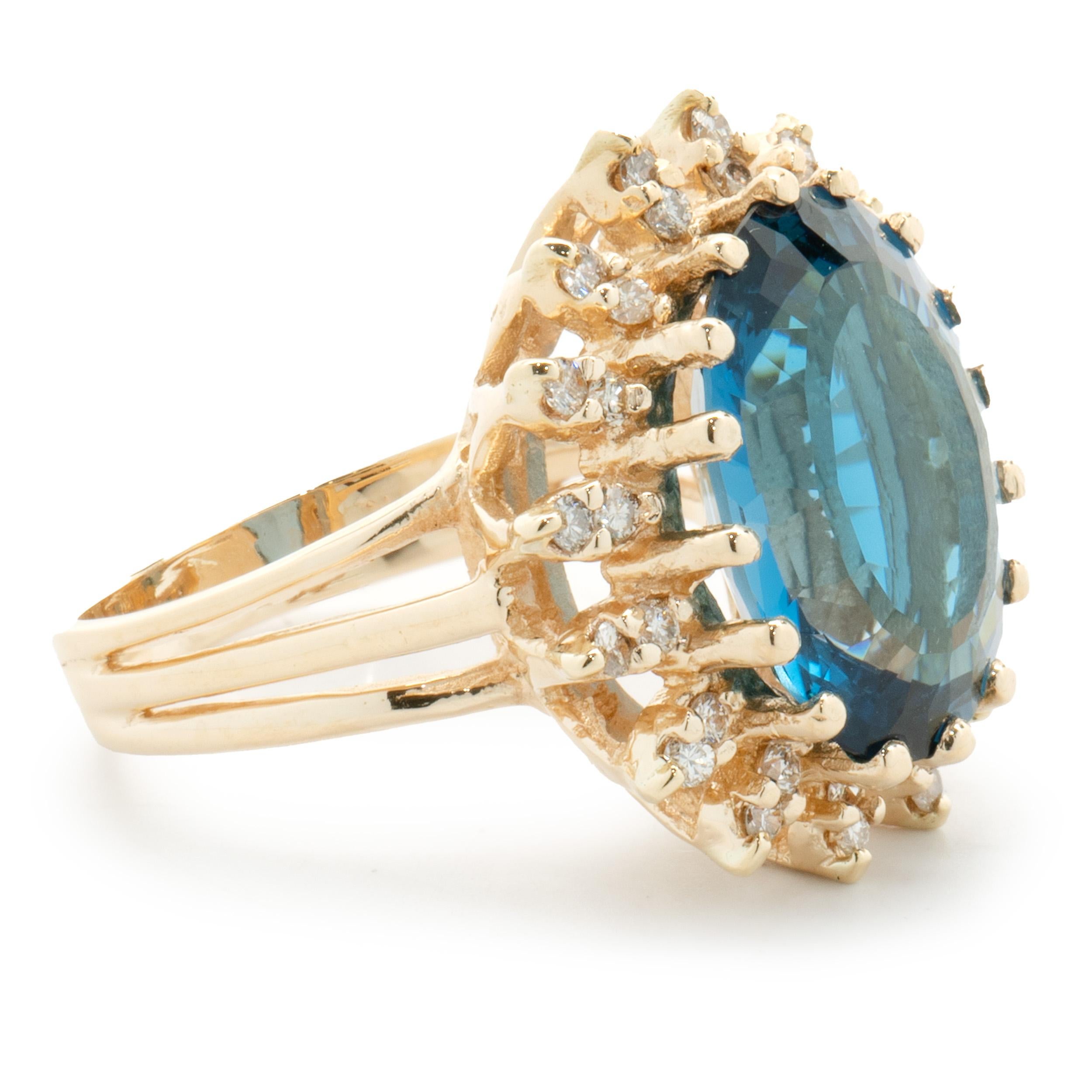 Oval Cut 14 Karat Yellow Gold Oval London Blue Topaz and Diamond Cocktail Ring