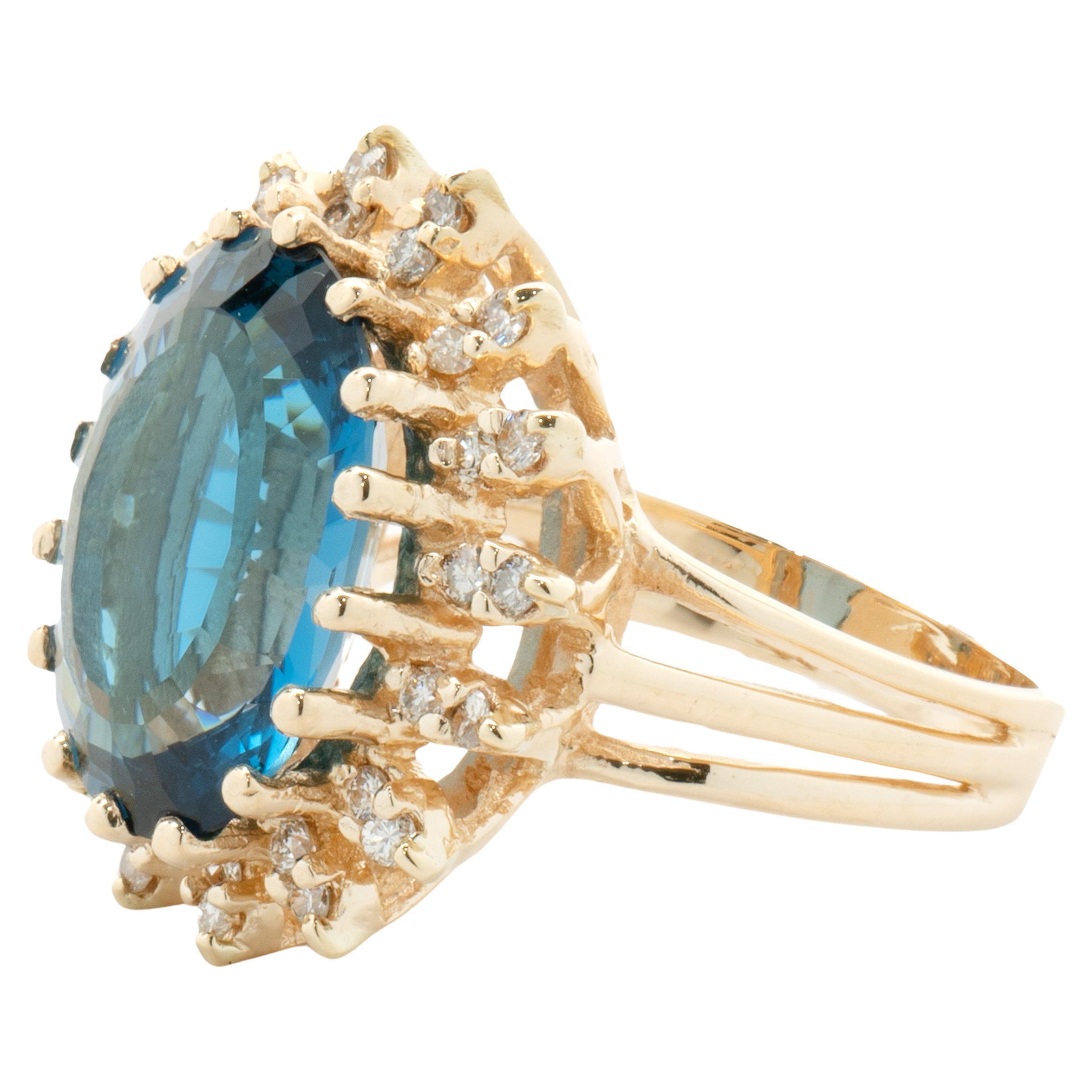 Designer: custom
Material: 14K yellow gold
Diamond: 32 round brilliant cut = 0.60cttw
Color: K
Clarity: SI1-2
Blue Topaz: 1 oval cut 9.20ct
Dimension: ring top measures 32mm wide
Ring Size: 7 (please allow two extra shipping days for sizing