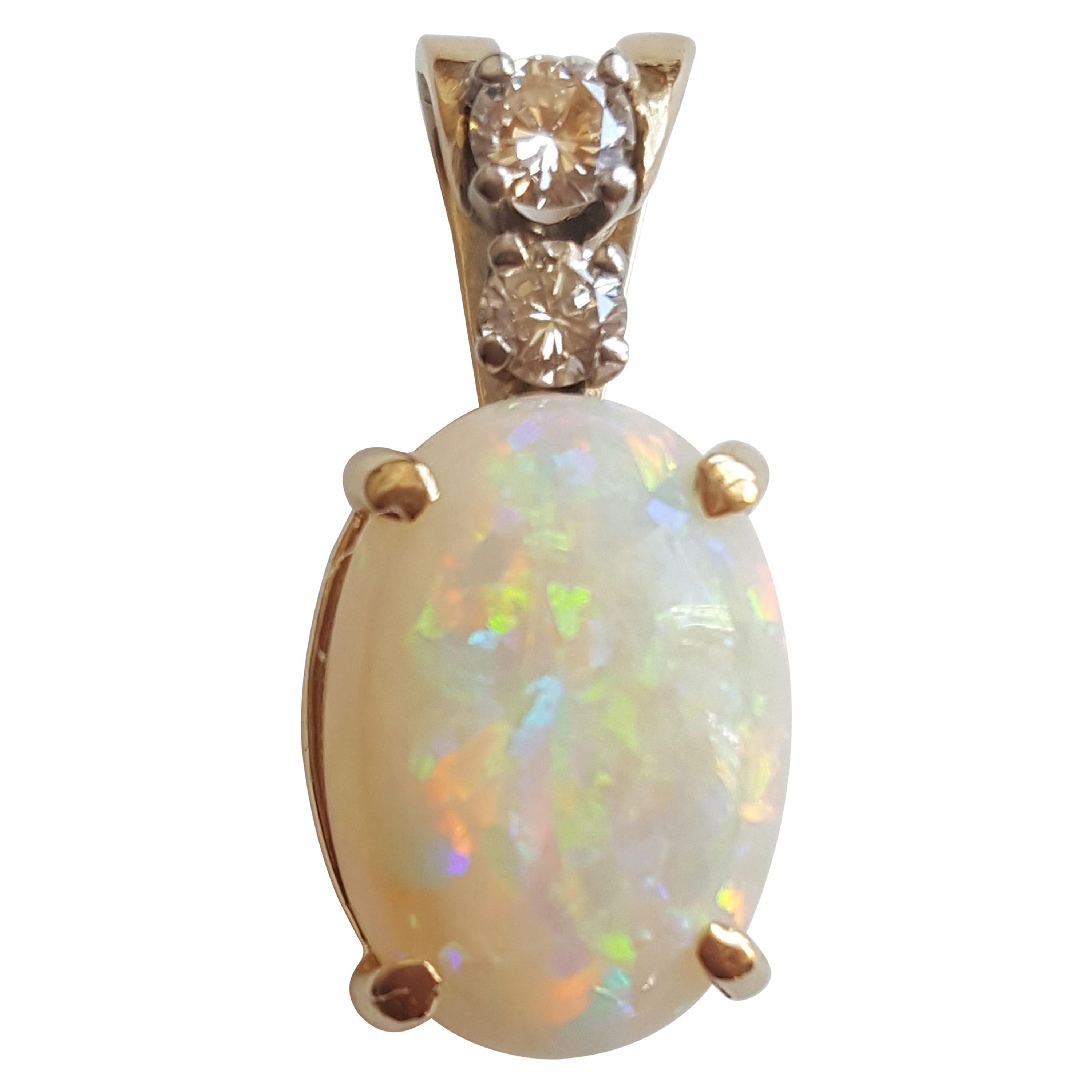14 Karat Yellow Gold Oval Opal, Round Brilliant Diamond Three-Stone Pendant