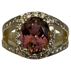 14 Karat Yellow Gold Oval Pink Tourmaline Diamond Halo Ring