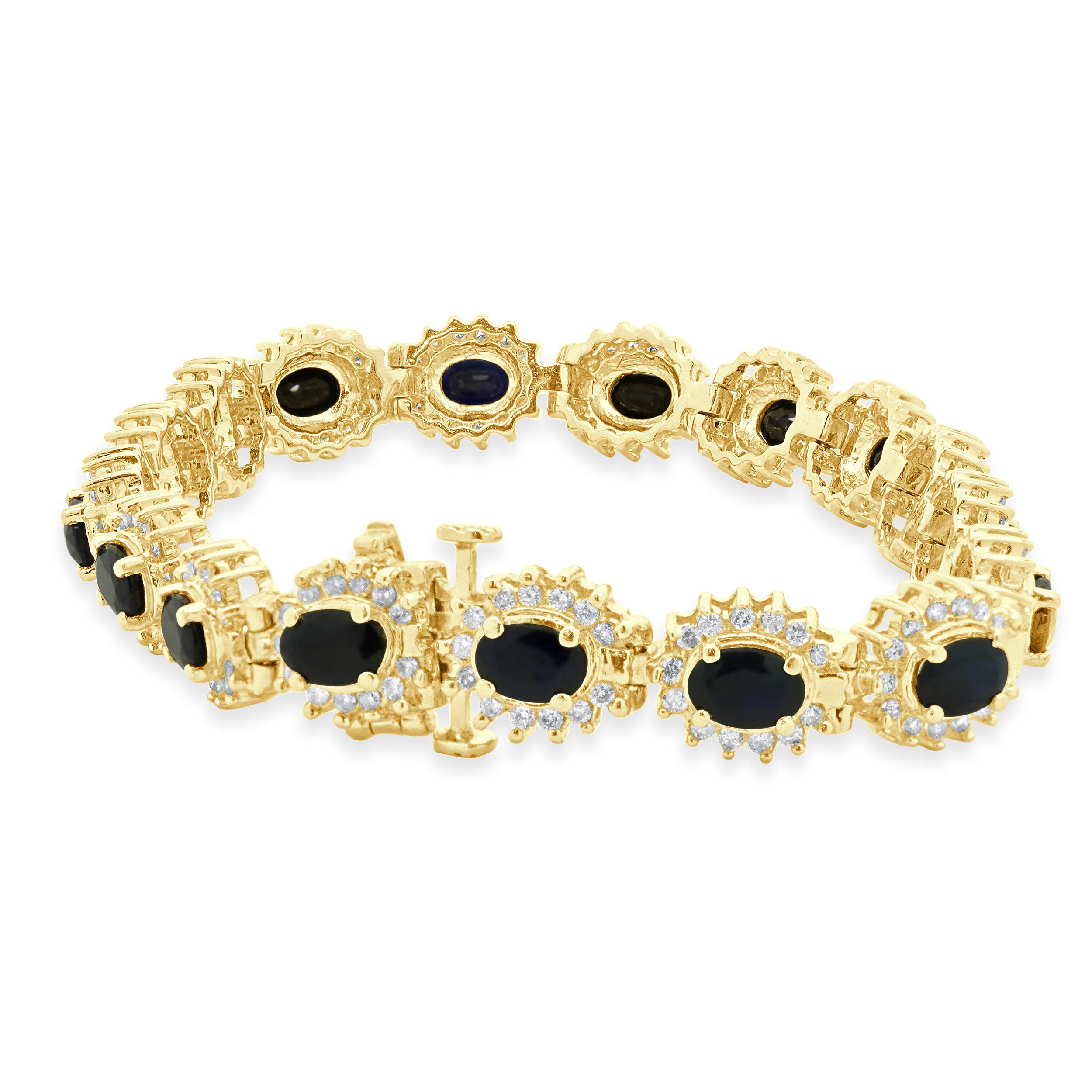 Designer: custom
Material: 14K yellow gold
Diamond: 221 round brilliant cut = 1.10cttw
Color: I
Clarity: SI2
Sapphire: 17 oval cut = 6.80cttw
Length: bracelet will fit up to a 7.25-inch wrist
Weight: 23.52 grams