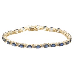 14 Karat Yellow Gold Oval Sapphire and Diamond Inline Tennis Bracelet