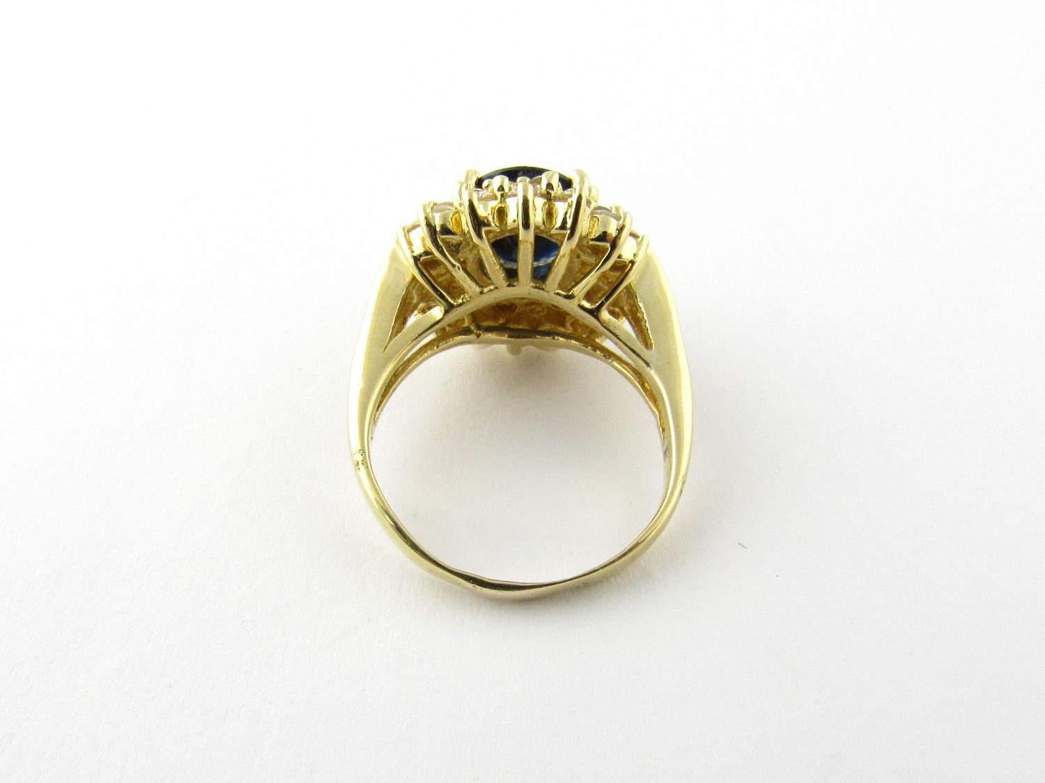 Round Cut 14 Karat Yellow Gold Oval Sapphire and Diamond Ring