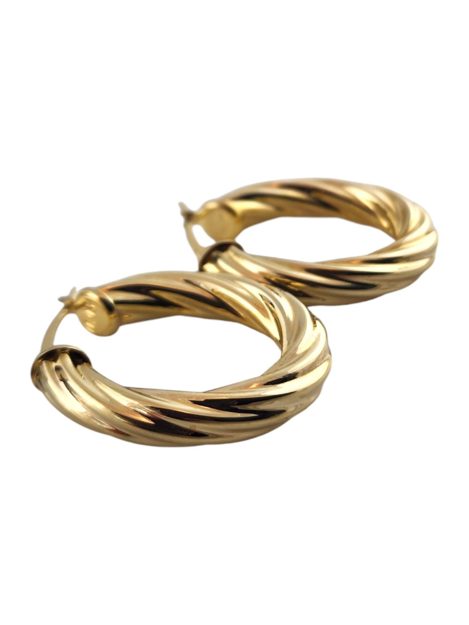 Women's 14 Karat Yellow Gold Oval Twisted Hoop Earrings #18987 For Sale