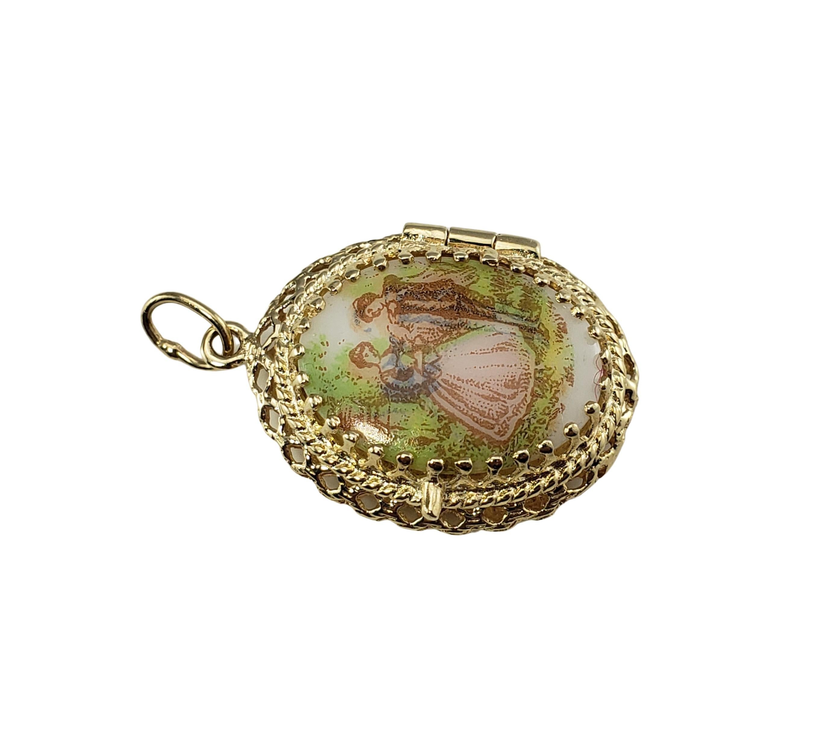14 Karat Yellow Gold Painted Cameo Locket Pendant-

This lovely painted cameo locket is crafted in beautifully detailed 14K yellow gold.  

Size:  26 mm x 19 mm 

Weight:  2.9 dwt. /  4.6 gr.

Stamped: 14K

Very good condition, professionally