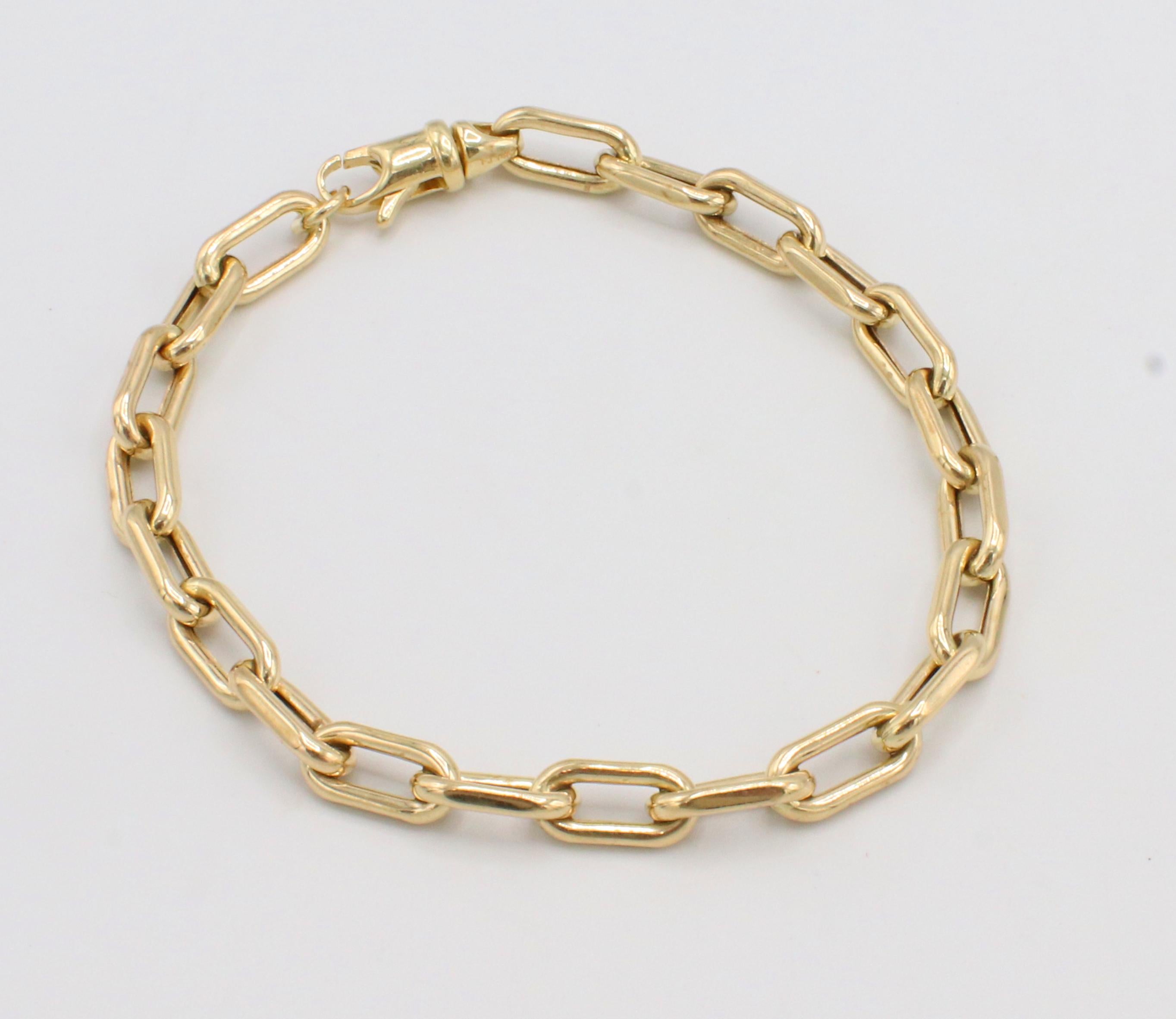 14 Karat Yellow Gold Paper Clip Chain Link Bracelet 
Metal: 14k yellow gold
Weight: 6.5 grams
Length: 7 inches
Links: 11 x 5.3mm
