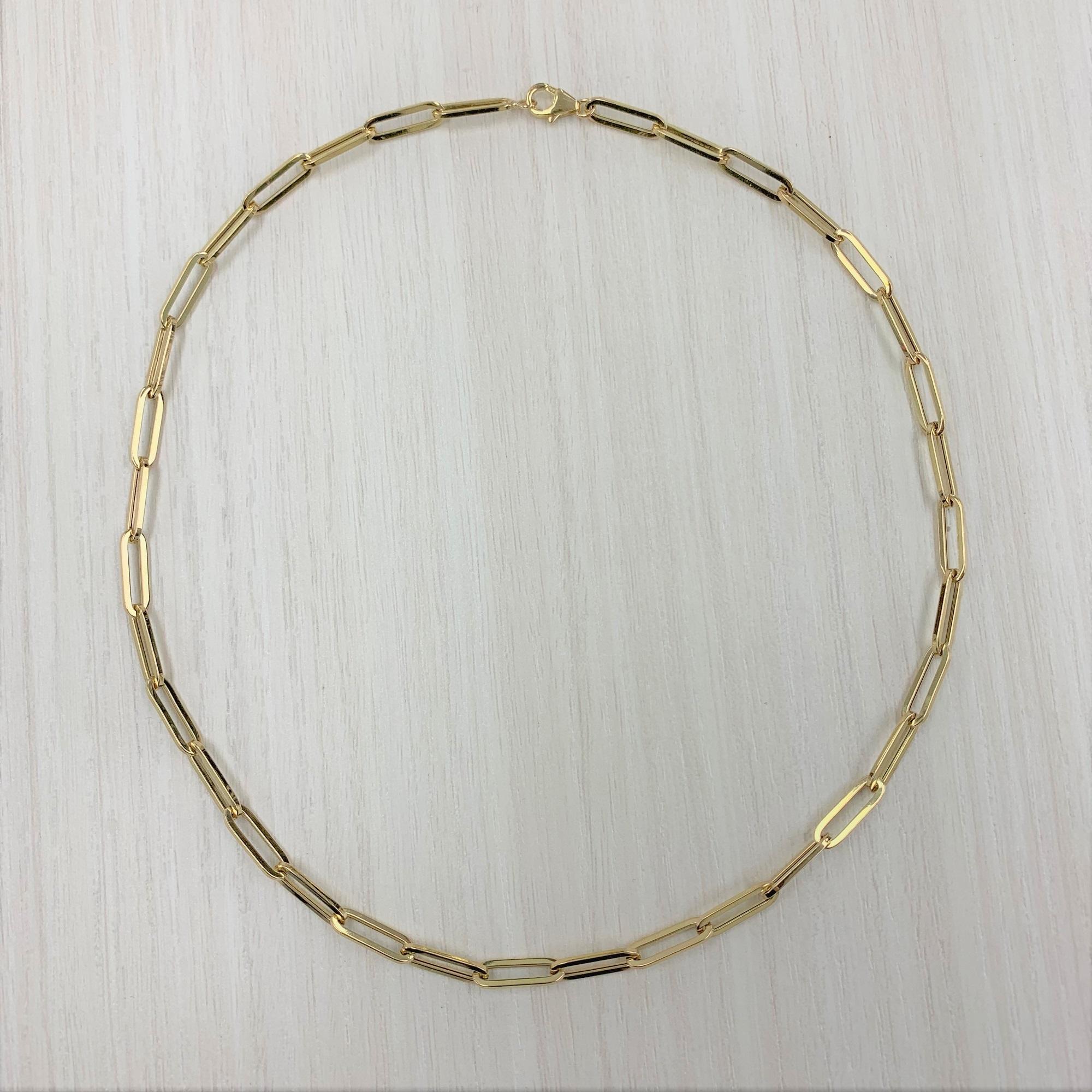  Chain necklaces are a classic staple in any person's jewelry box!  This 14k yellow gold paper-clip medium link chain comes with plenty of options, specifically your choice of length. Buy one and wear it as a simple standalone (with or without a
