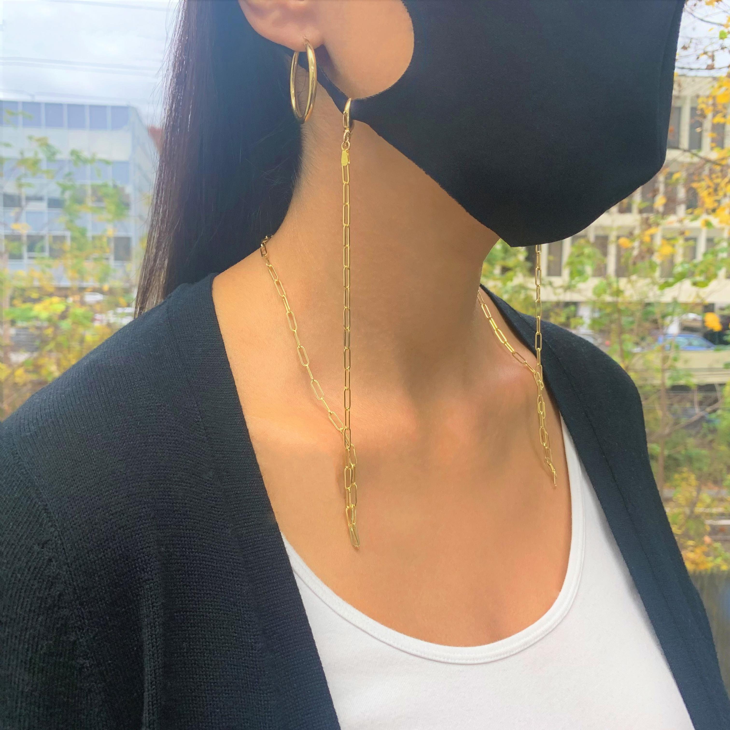 Style meets function with our 14K Yellow Gold Paperclip convertible Chain Mask Necklace. Made to keep your newfound essential within reach at all times, simply hook the chain to the ear loops of your favorite face covering. When you're not wearing
