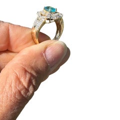 14 Karat Yellow Gold Paraiba Tourmaline Diamond Halo 1.30ctw Ring