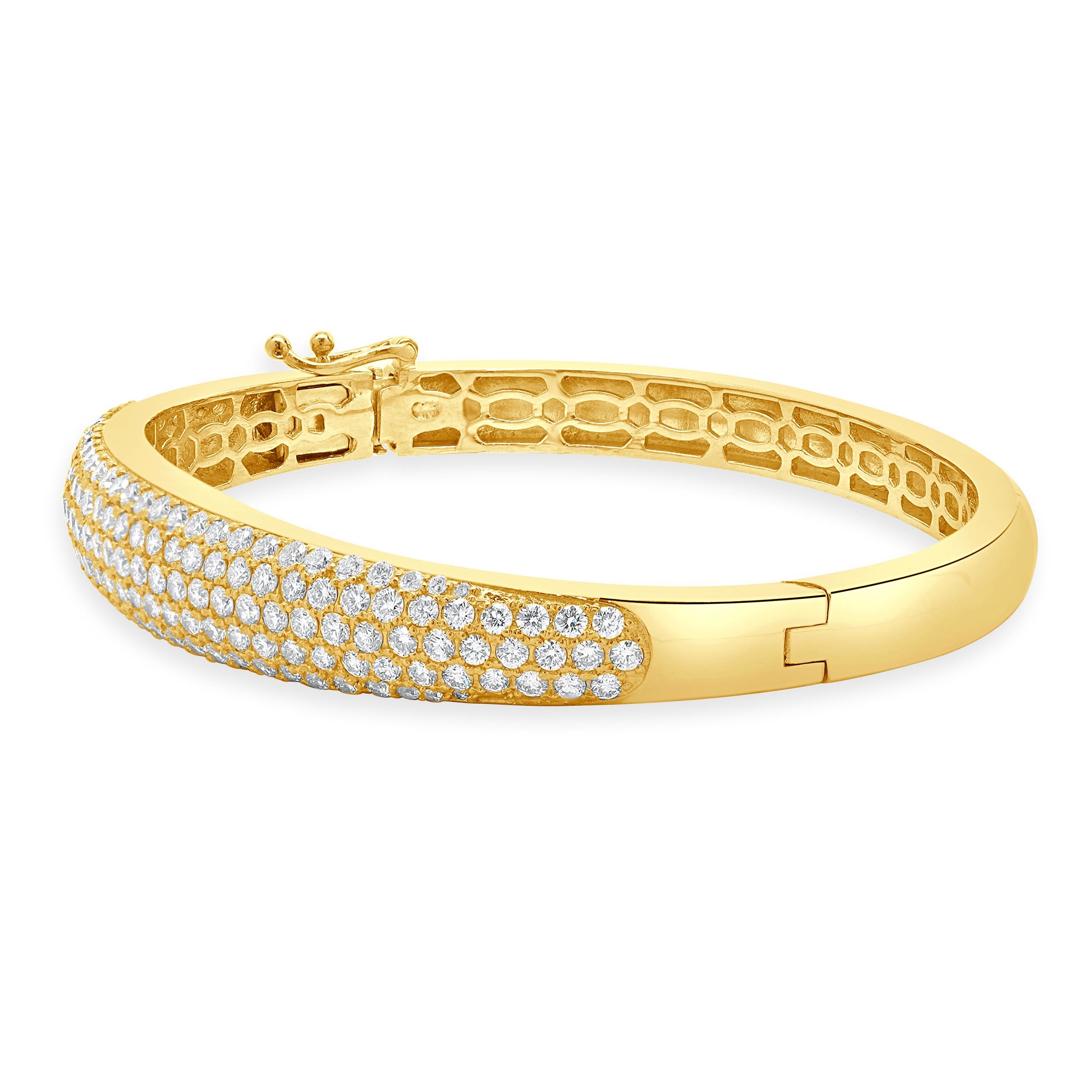 Designer: custom design
Material: 14K yellow Gold
Diamond:  round brilliant cut= 5.01cttw
Color: G
Clarity: VS-SI1
Dimensions: bracelet will fit up to a 7-inch wrist
Weight: 28.26 grams
