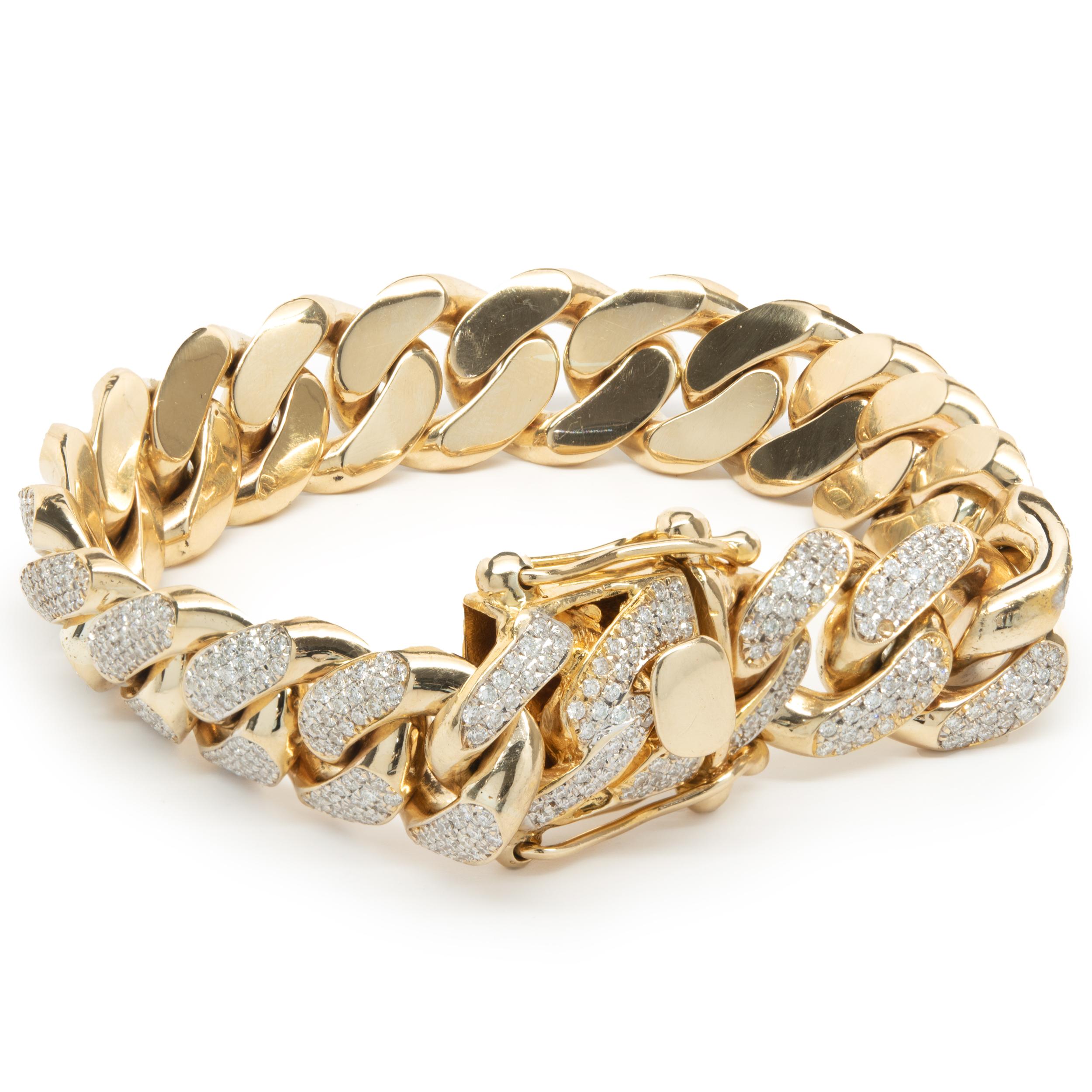 Designer: custom 
Material: 14K yellow gold
Diamond: round brilliant cut = 10.00cttw
Color:  G
Clarity: VS1-2
Dimensions: bracelet will fit up to a 9-inch wrist
Weight: 145.36 grams
