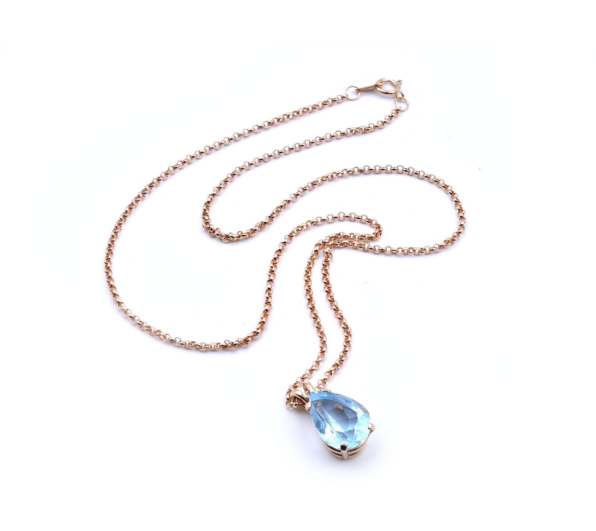 Designer: custom
Material: 14K yellow gold
Blue Topaz: 1 pear cut = 4.77ct
Dimensions: the pendant measures 16.04mm x 9.01mm 
Weight: 1.94 grams

