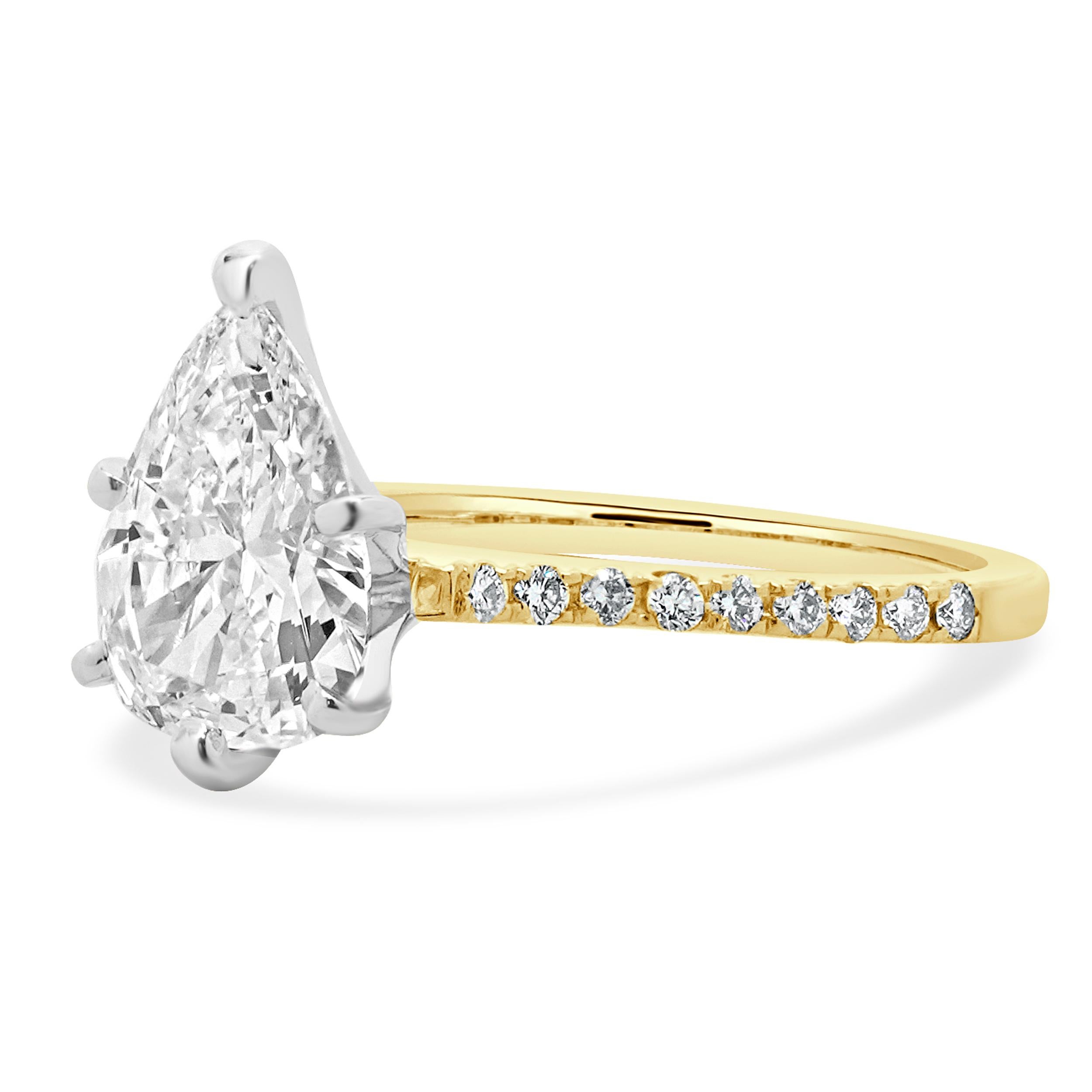 Material: 14K yellow gold
Center Diamond: 1 pear cut = 1.53ct
Color: G
Clarity: VS2
GIA: 1236489331
Diamond: 18 round brilliant cut = 0.18cttw
Color: G
Clarity: VS1-2
Ring Size: 5.75 (please allow up to 2 additional business days for sizing