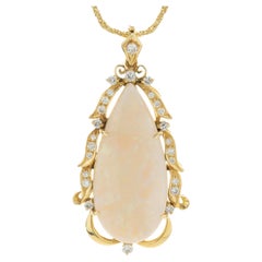 14 Karat Yellow Gold Pear Cut Opal and Diamond Freeform Pendant