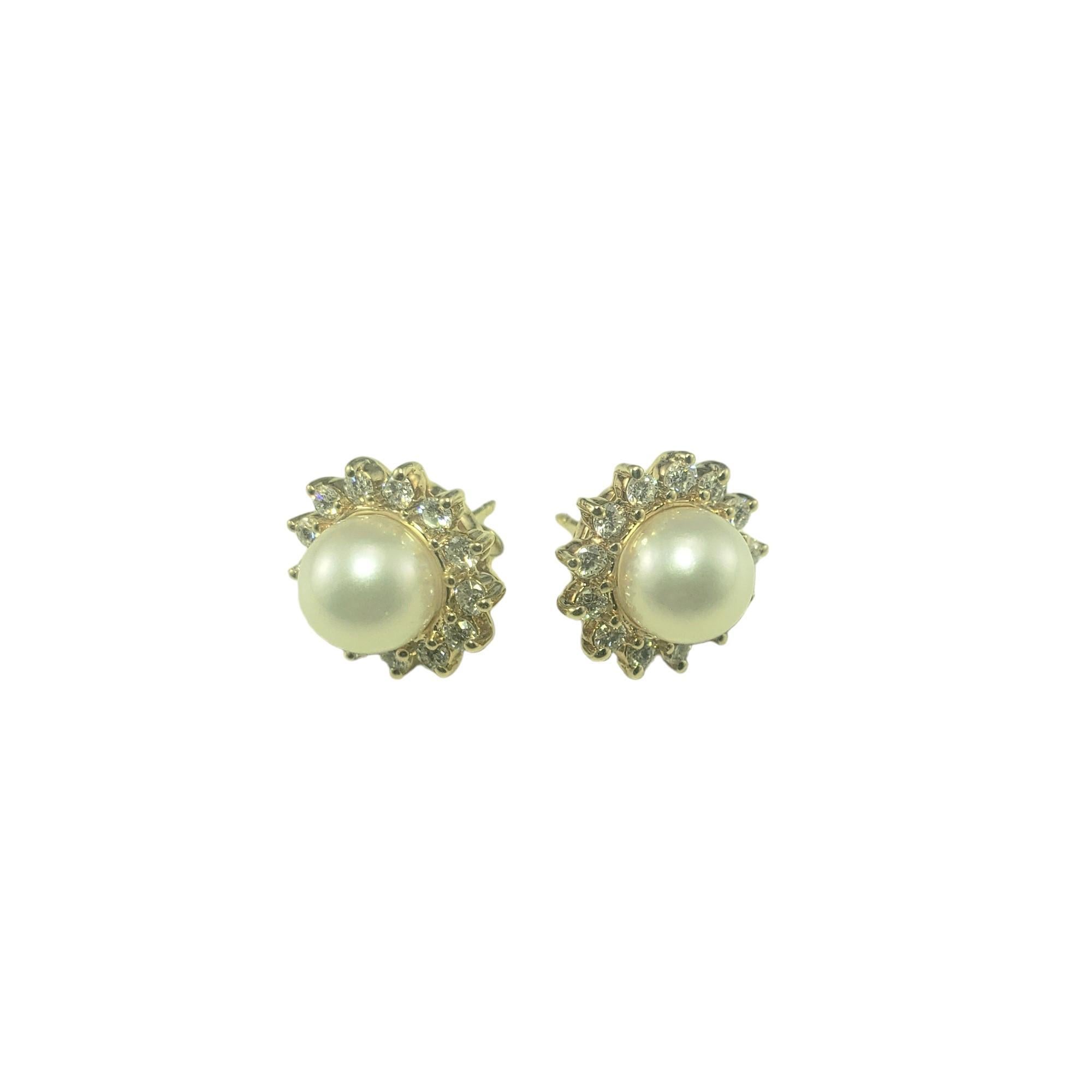 Vintage 14 Karat Yellow Gold Pearl and Diamond Earrings-

These stunning earrings each feature one round pearl (8 mm) surrounded by 13 round brilliant cut diamonds set in classic 14K yellow gold.  Push back closures.

Approximate total diamond