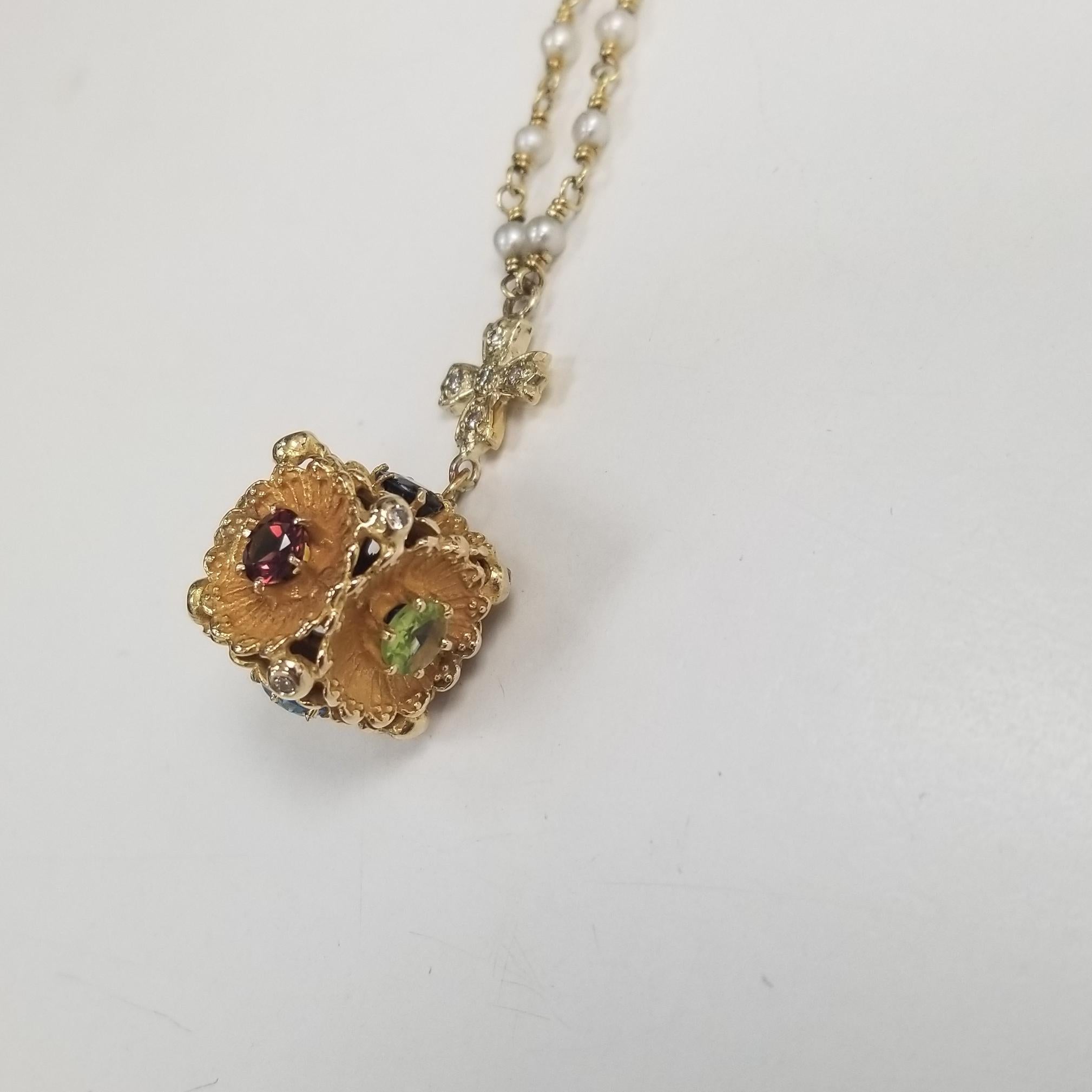 14k yellow gold pearl and diamond Fab necklace with multi color gemstones, containing 
 Specifications:
    main stone: ROUND Color Gemstones
    diamonds: 6 PIECES
    carat total weight: 3.20cts.    
    additional: 13 round diamonds
    color: G
