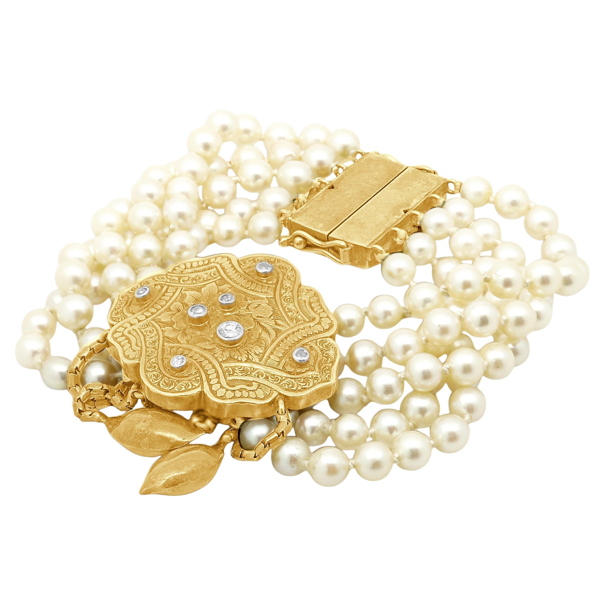 Bracciale in oro giallo 14 carati con perle e diamanti incisi a mano