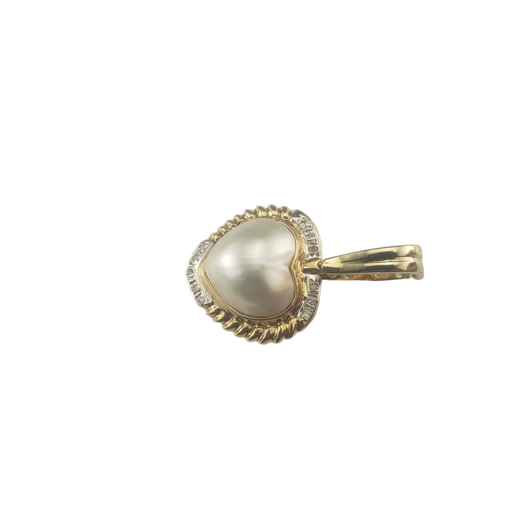 14 Karat Yellow Gold Pearl and Diamond Heart Pendant Enhancer-

This lovely pearl heart pendant features 11 round single cut diamonds set in classic 14K yellow gold.

Approximate total diamond weight: .05-.10 ct.

Diamond color: I

Diamond clarity: