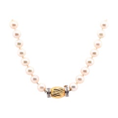 14 Karat Yellow Gold Pearl and Diamond Knotted Necklace 14 Karat Yellow Gold Pearl and Diamond Knotted Necklace