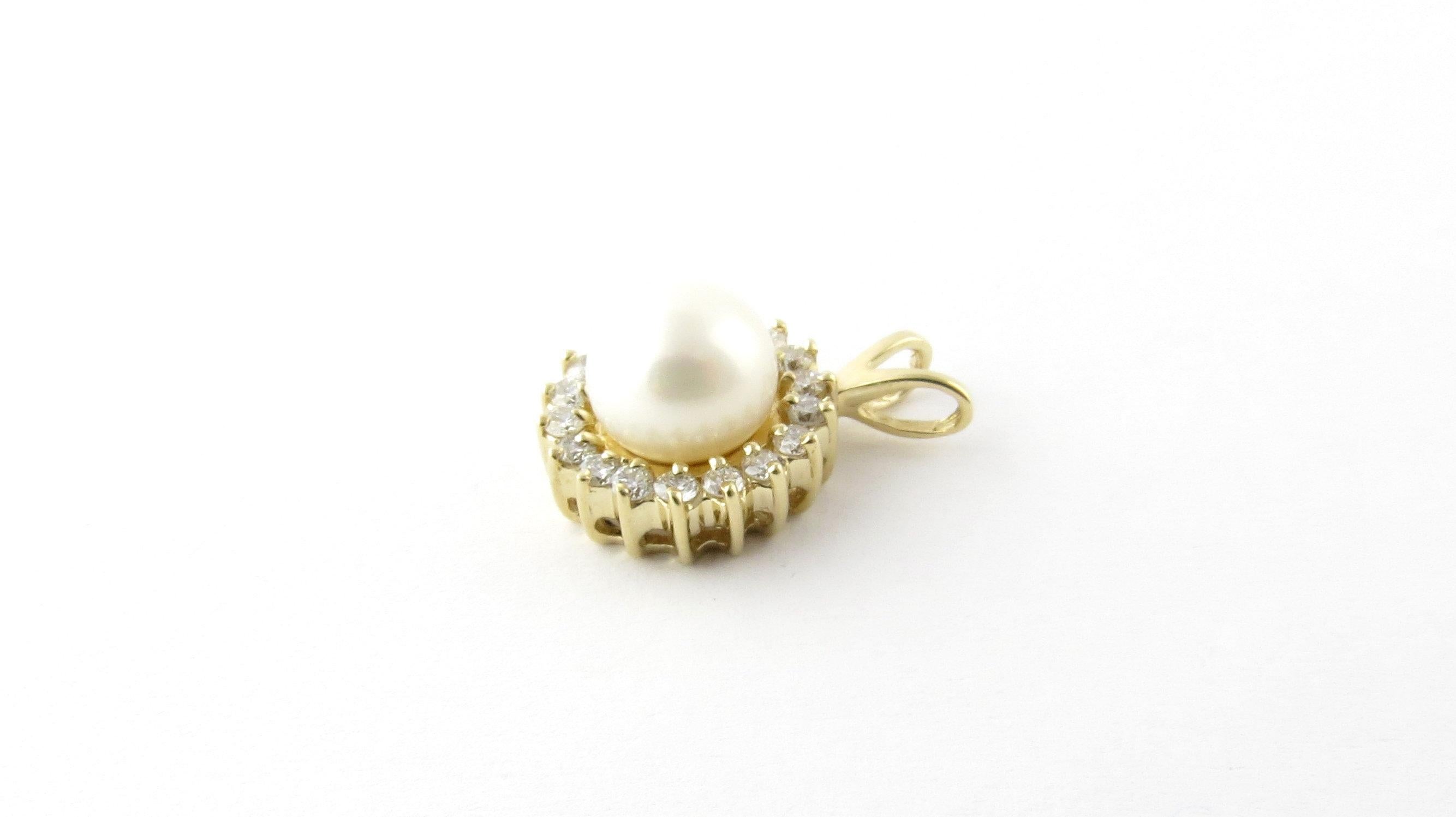 Vintage 14 Karat Yellow Gold Pearl and Diamond Pendant-

This stunning pendant features one 9 mm cultures pearl surrounded by 18 round brilliant cut diamonds and set in classic 14K yellow gold.

Approximate total diamond weight: .72 ct.

Diamond