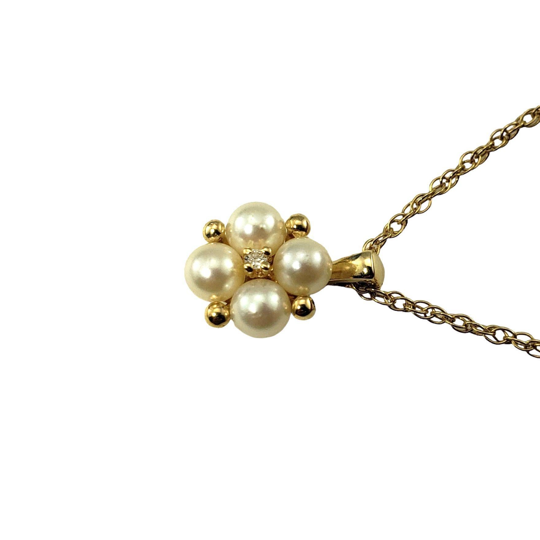 14 Karat Yellow Gold Pearl and Diamond Pendant Necklace-

This elegant pendant necklace features four round white pearls (4 mm each) and one round brilliant cut diamond set in classic 14K yellow gold.

Approximate total diamond weight: .01