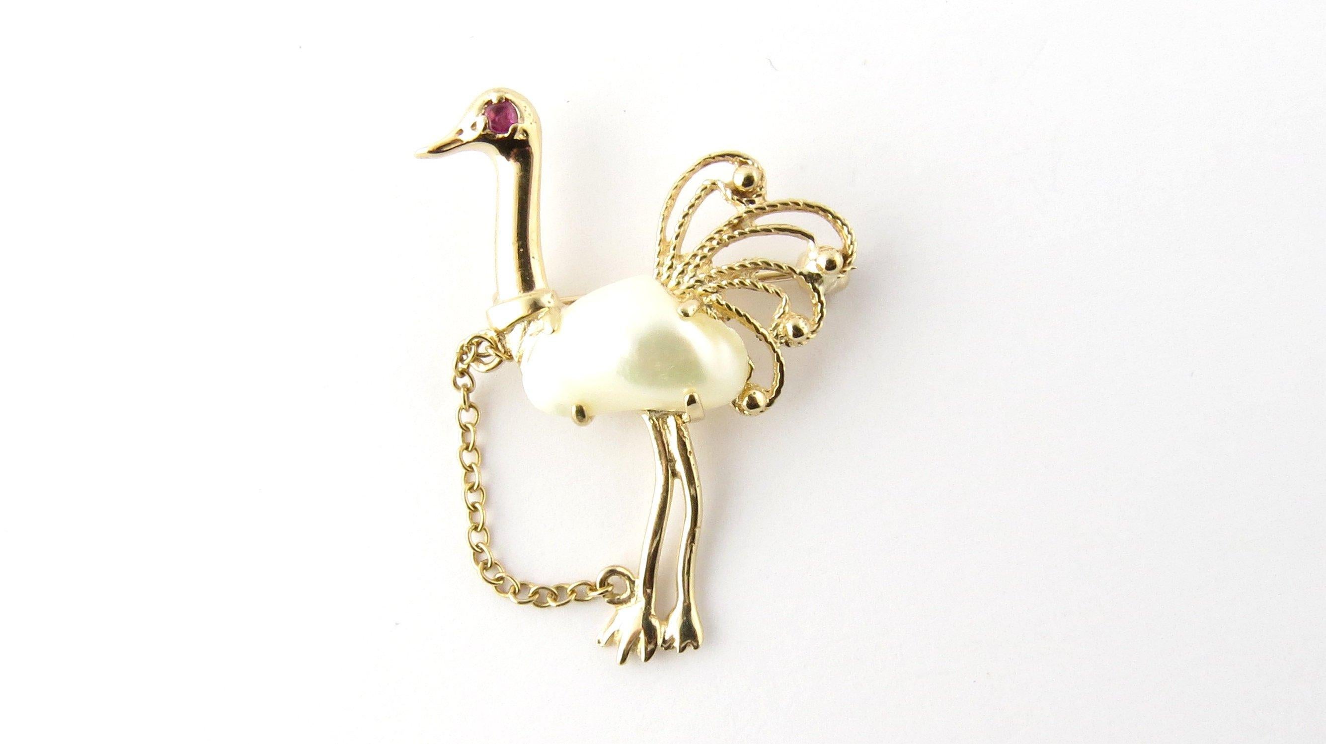 Vintage 14 Karat Yellow Gold Pearl and Ruby Ostrich Brooch/Pin-

This beautiful brooch features a lovely ostrich decorated with one pearl (12 mm x 9 mm) and one genuine ruby. Meticulously detailed in 14K yellow gold.

Size: 35 mm x 26 mm

Weight: