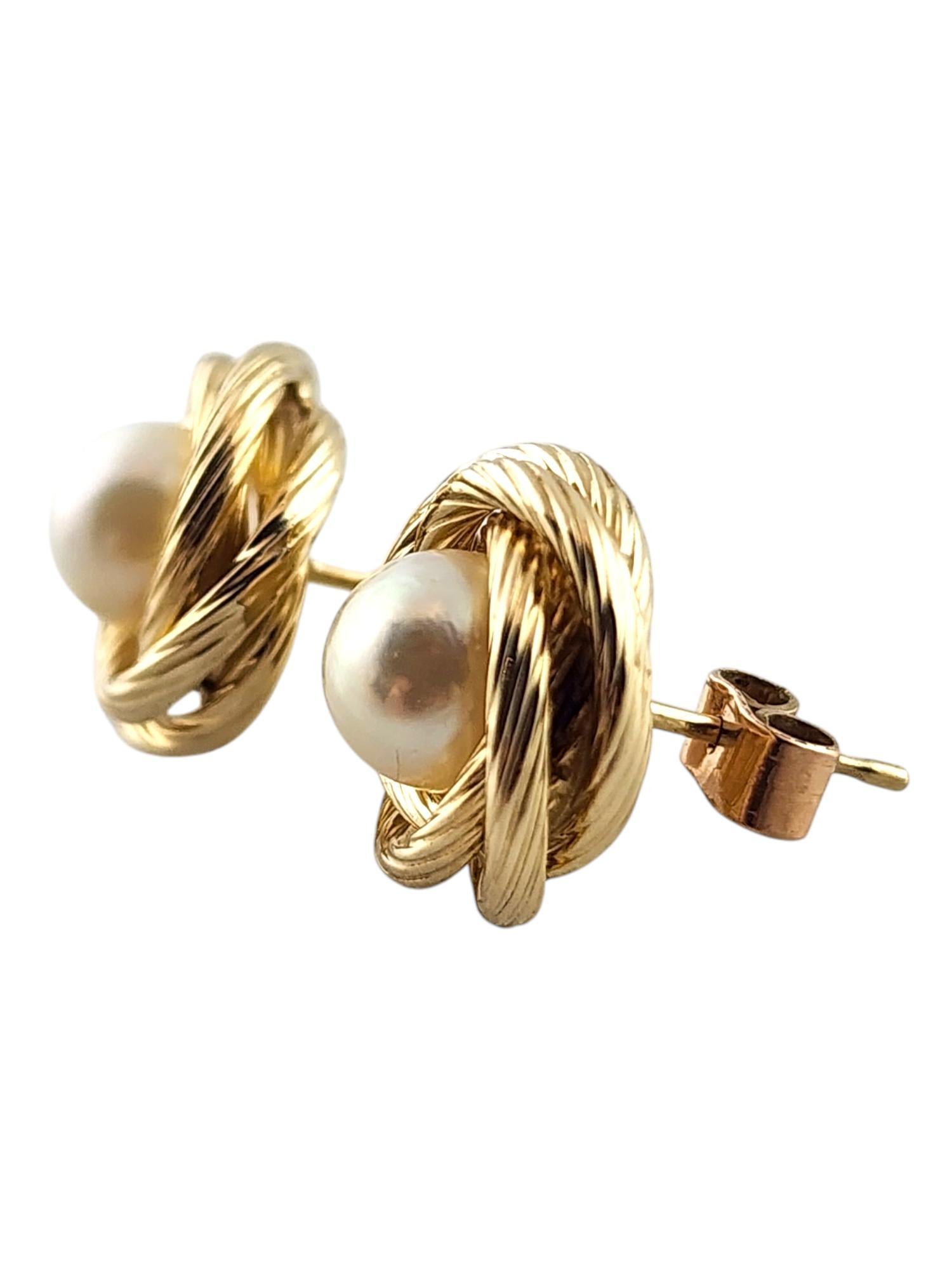 14 Karat Yellow Gold Pearl Knot Earrings

This beautiful set of stud earrings features 2 white pearls set in 14K yellow gold knots!

Size: 12.5mm X 12.5mm X 7.92mm

Weight: 3.83 g/ 2.47 dwt

Tested 14K

Very good condition, professionally