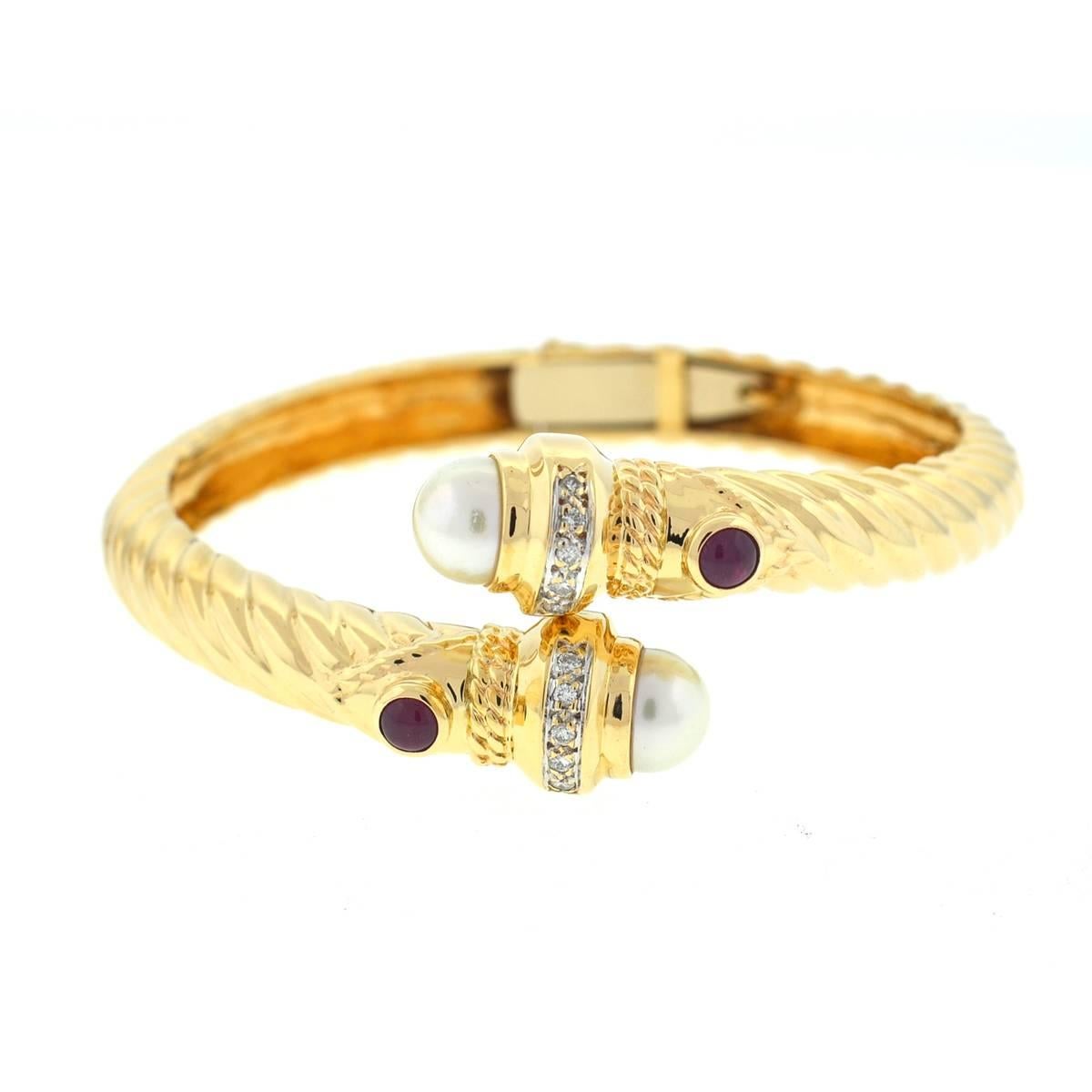 Style - Bangle
Metal - 14k Yellow Gold
Stones - Pearl, Ruby & Diamonds
Weight - 33.9 Grams  - Fits a 6.5