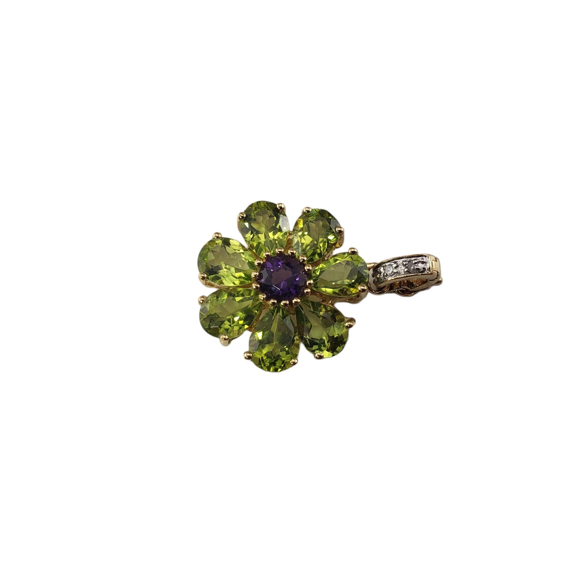 Vintage 14 Karat Yellow Gold Peridot and Amethyst Flower Enhancer-

This elegant enhancer features six peridot gemstones, one amethyst and three round single cut diamonds set in a lovely flower design.

Approximate total diamond weight:   .02