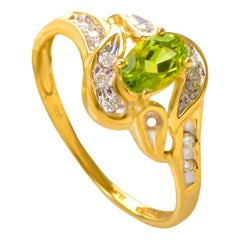 14 Karat Yellow Gold Peridot Gemstone and Diamond Swirl Ring RM1544P