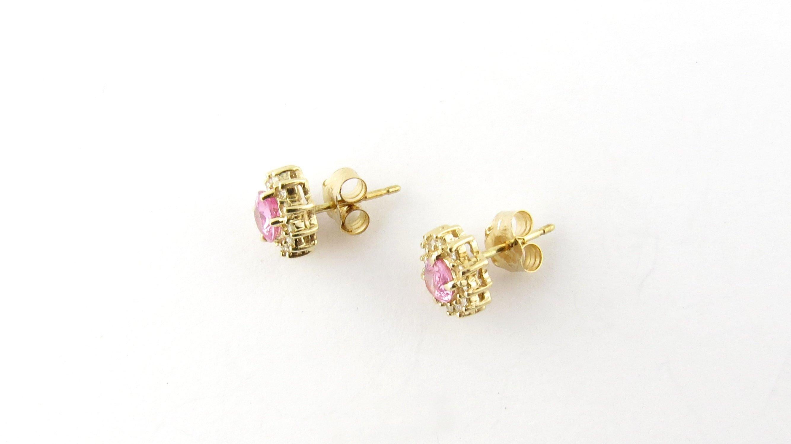 Vintage 14 Karat Yellow Gold Pink Gemstone and Diamond Earrings
These sparkling earrings each feature one oval pink gemstone (6 mm x 4 mm) surrounded by 12 round brilliant diamonds set in classic 14K yellow gold. Push back closures. 
Approximate