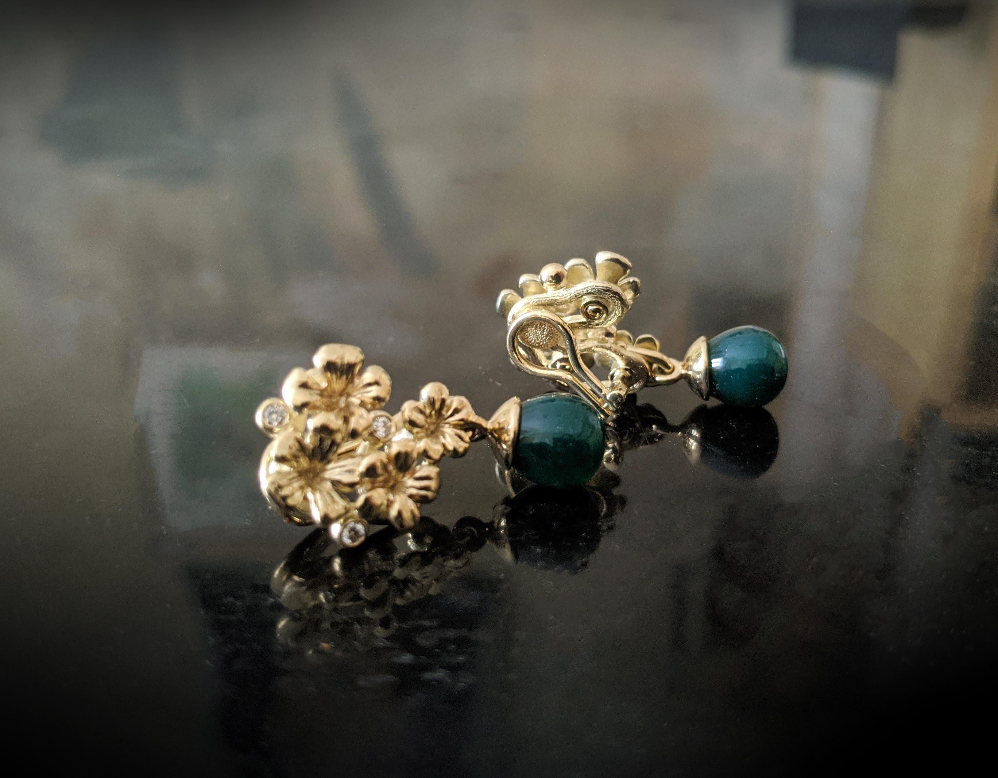 These clip-on earrings are made of 14-karat yellow gold and encrusted with 6 round diamonds and cabochon chalcedonies, which can be removed to wear the earrings separately. The size of one earring is 2x1.7 cm, and the depth without a lock is 5 mm.
