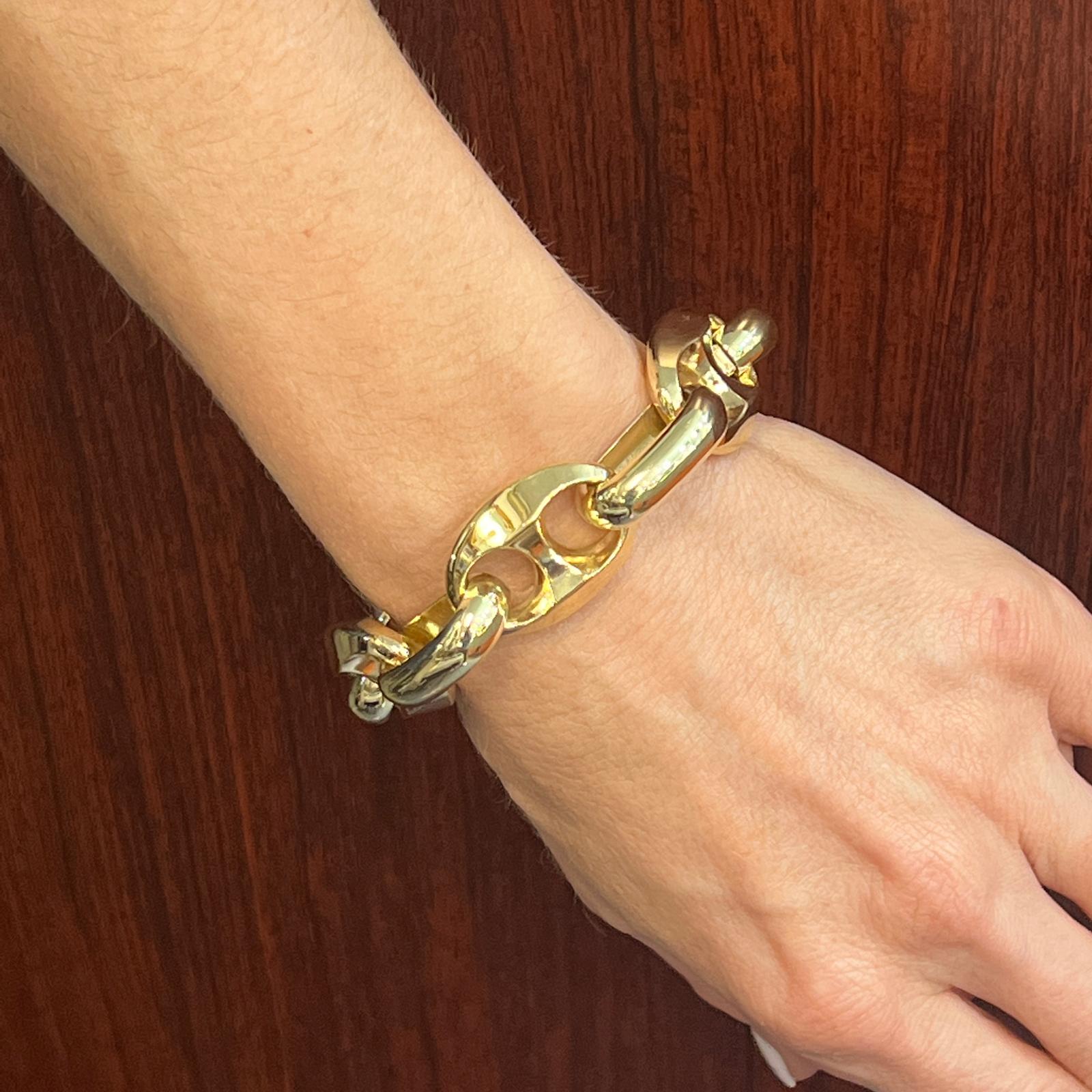 Fabulous puffed gold mariner link bracelet fashioned in 14 karat yellow gold. The bracelet has a nice weight, measures 20mm in width and 7.5 inches in length. Safety clasp. 